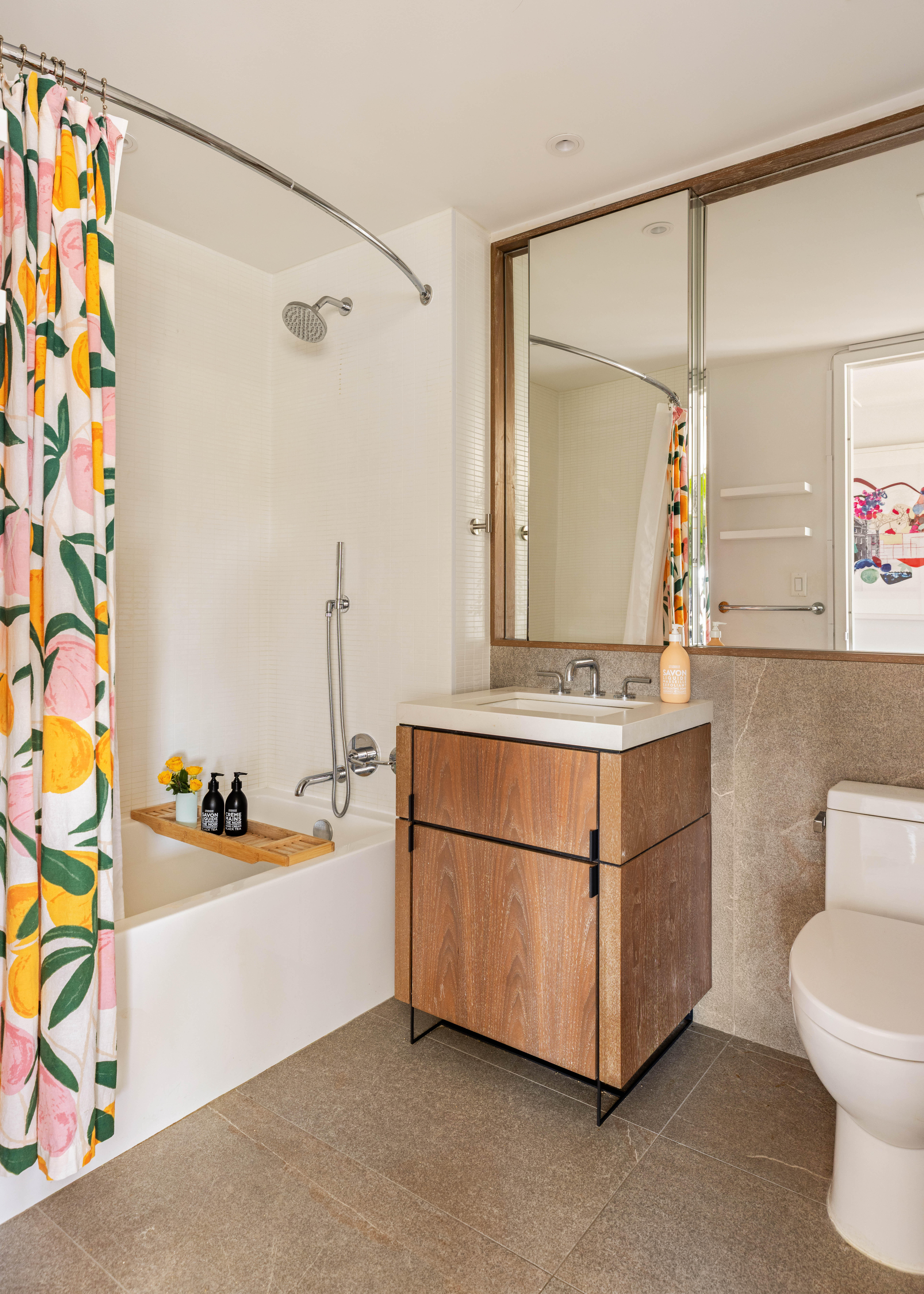 561 Pacific Street, Unit 803 Brooklyn, NY 11217 - Photo 8 of 16 a bathroom with a sink a mirror and a bathtub