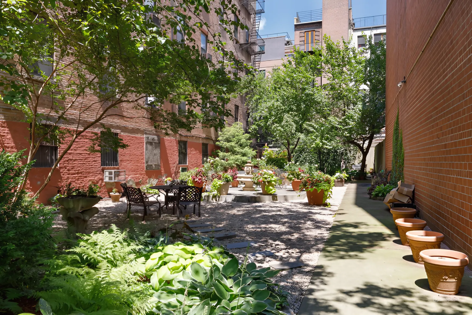 447 West 45th Street, Unit 5A Manhattan, NY 10036 - Photo 11 of 12 a view of a back yard of the house