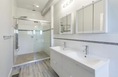 a view of hallway with wooden floor