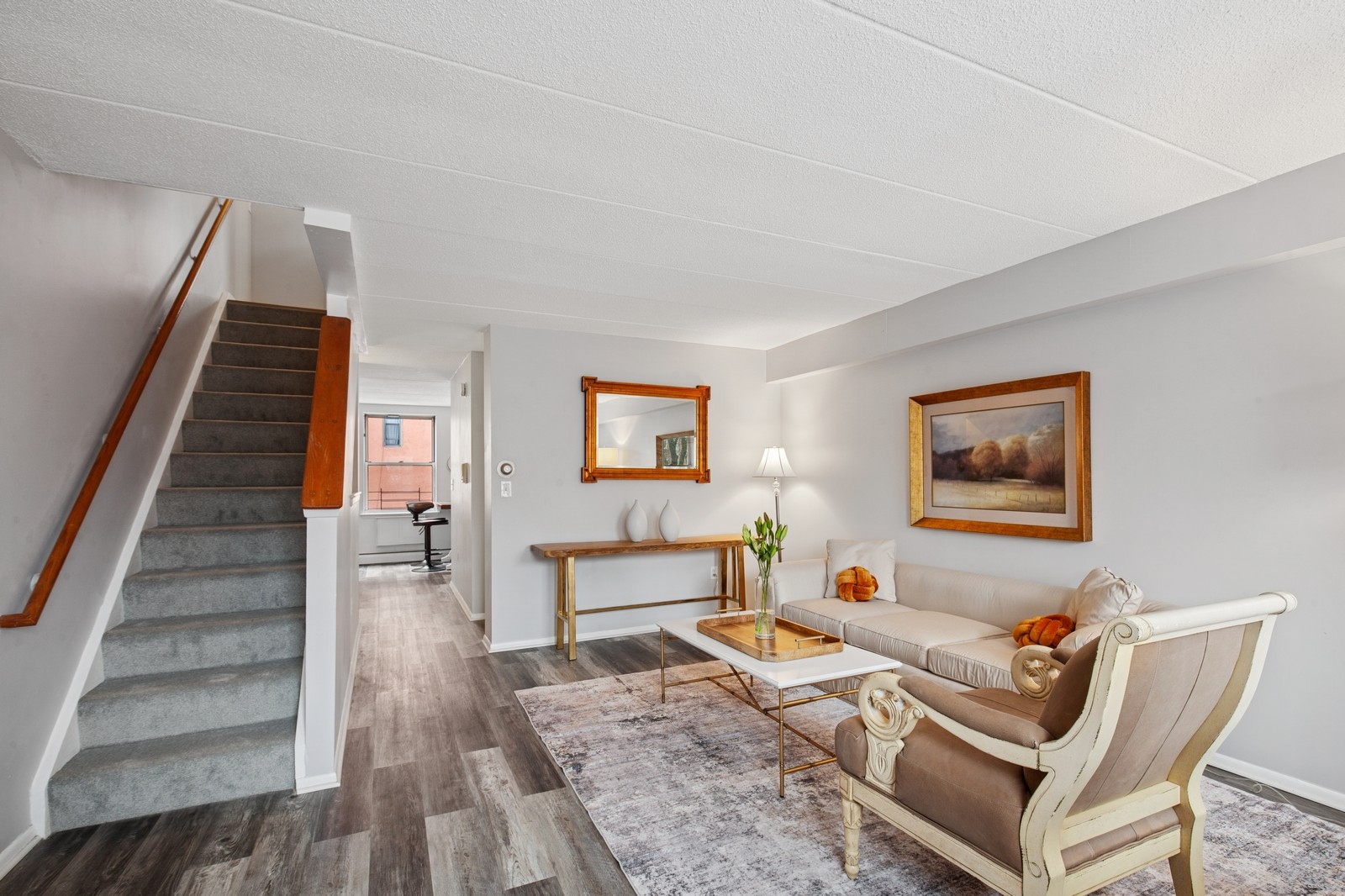 2551 Frederick Douglass Boulevard, Unit 2551D Manhattan, NY 10030 - Photo 3 of 11 a living room with furniture and wooden floor