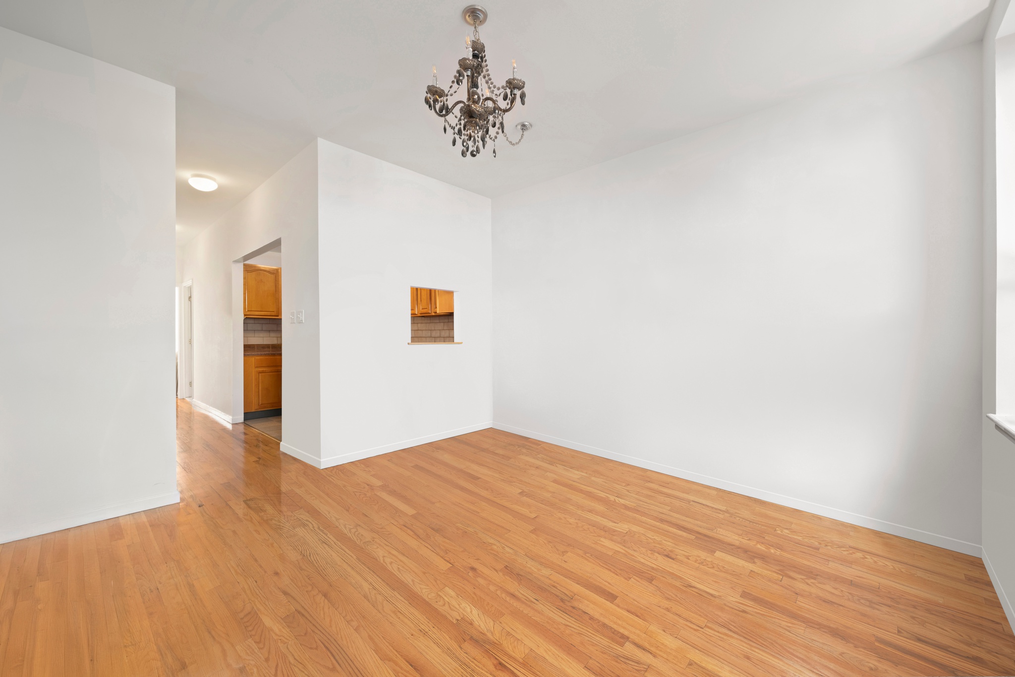 522 West 149th Street, Unit 3 Manhattan, NY 10031 - Photo 2 of 7 a view of an empty room with wooden floor