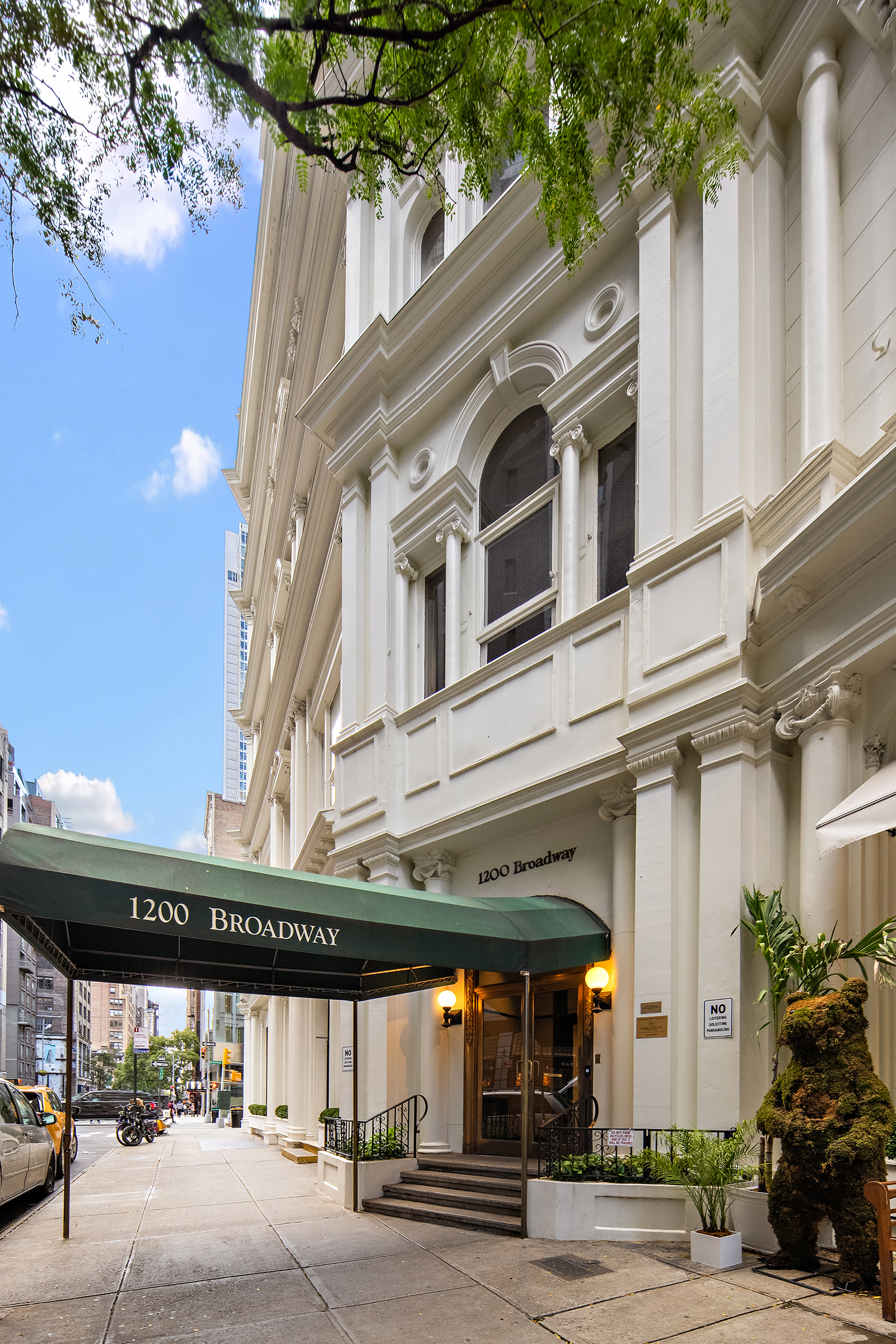 1200 Broadway, Unit PH89 Manhattan, NY 10001 - Photo 2 of 47 a view of a building with a pathway and a potted plant