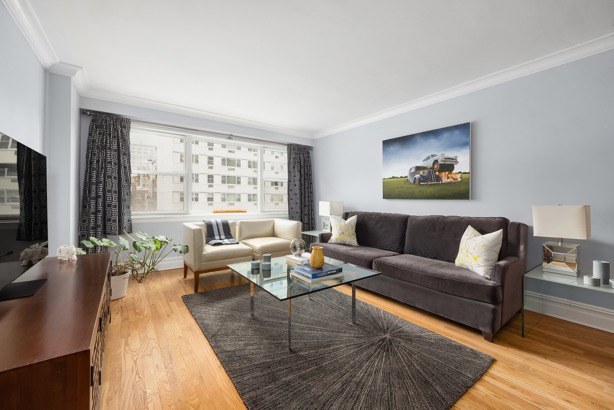 a living room with furniture and a flat screen tv