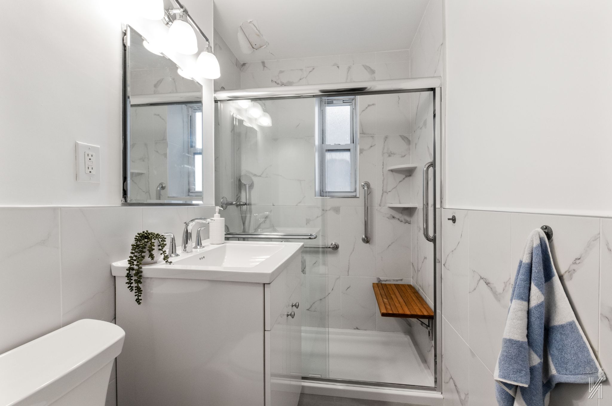 39-30 52nd Street, Unit GA Queens, NY 11377 - Photo 12 of 15 a bathroom with a sink and mirror