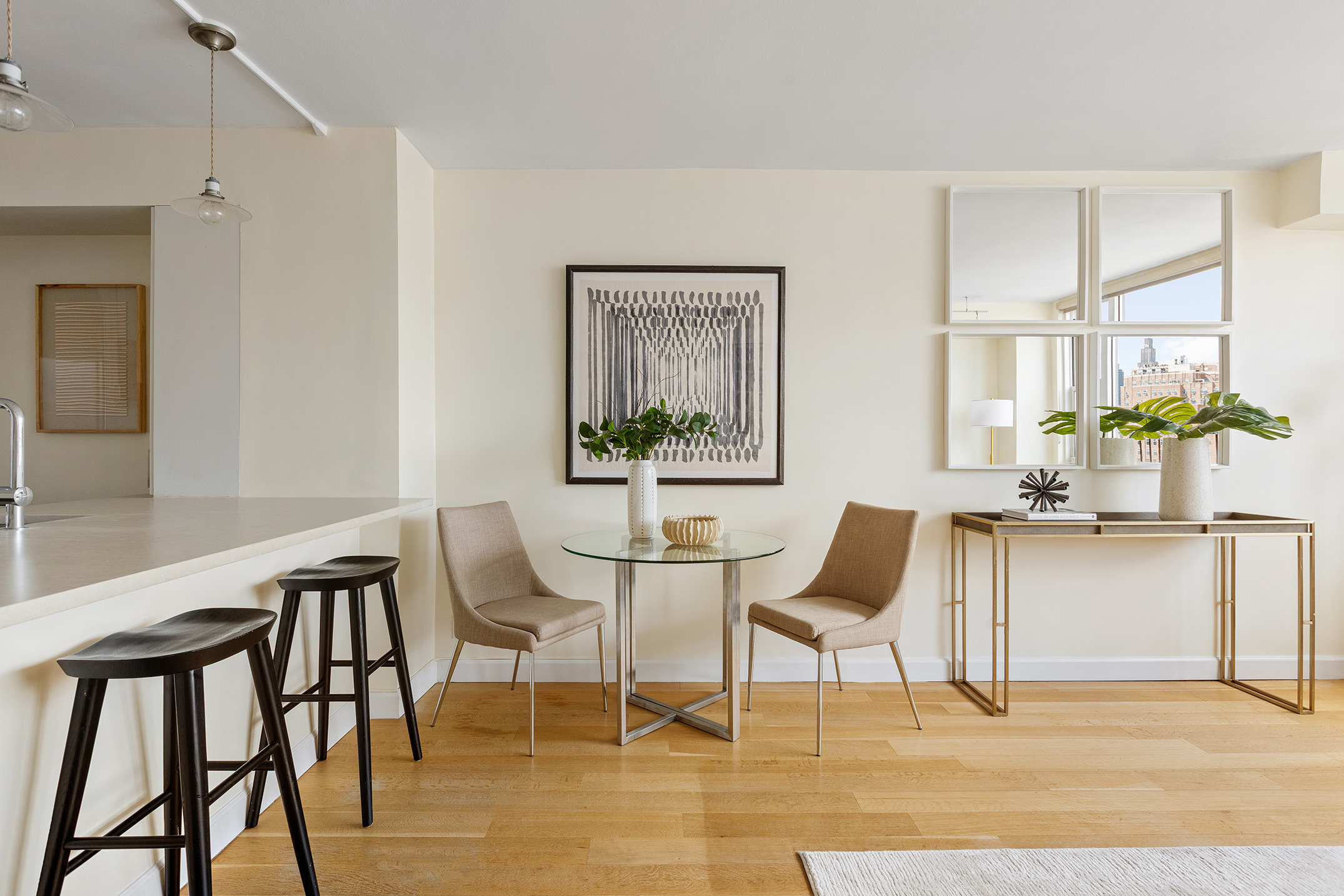 61 Jane Street, Unit 19J Manhattan, NY 10014 - Photo 4 of 12 a dining room with furniture and window
