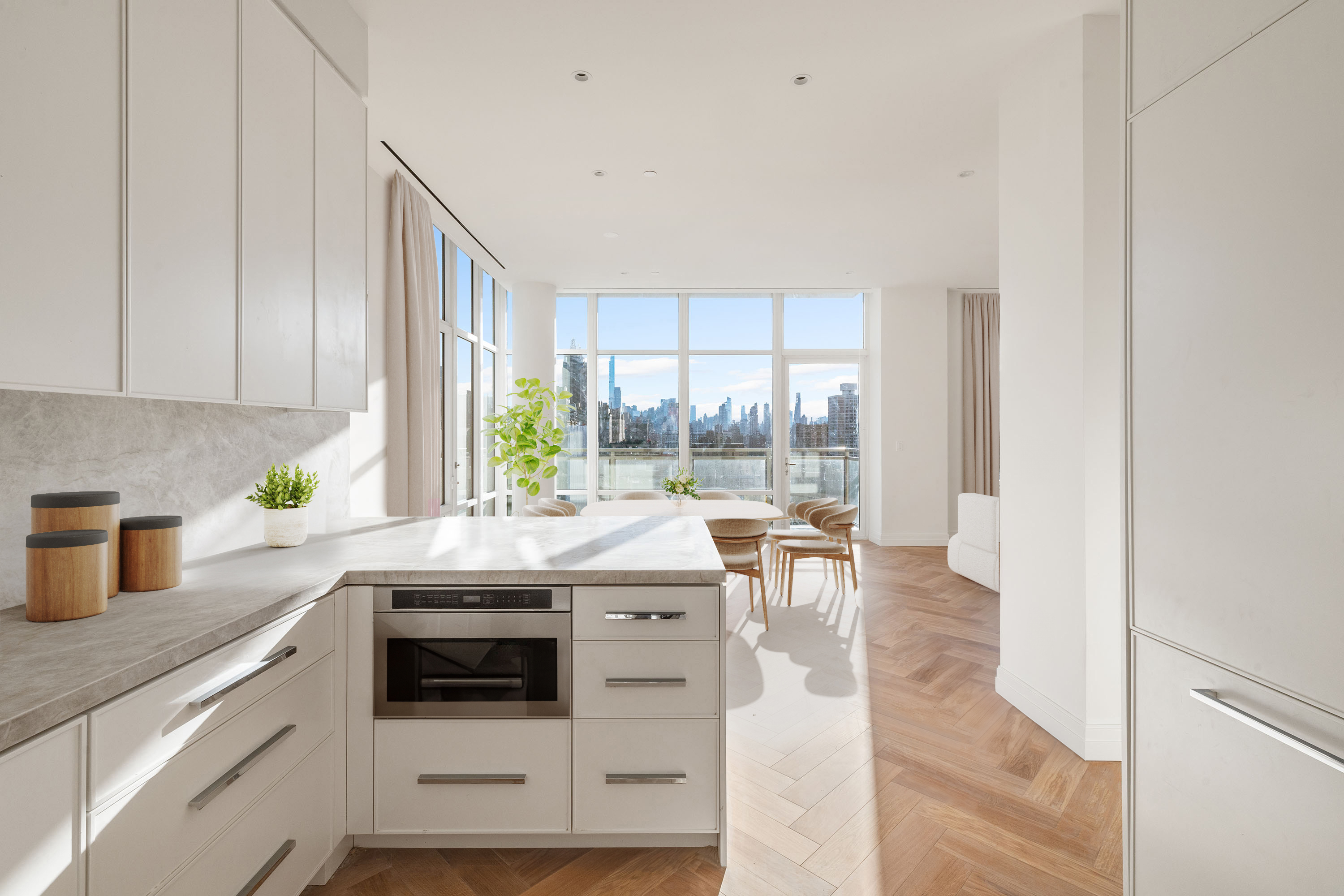 15 West 96th Street, Unit 19 Manhattan, NY 10025 - Photo 2 of 17 a kitchen with granite countertop a stove a sink and a cabinets