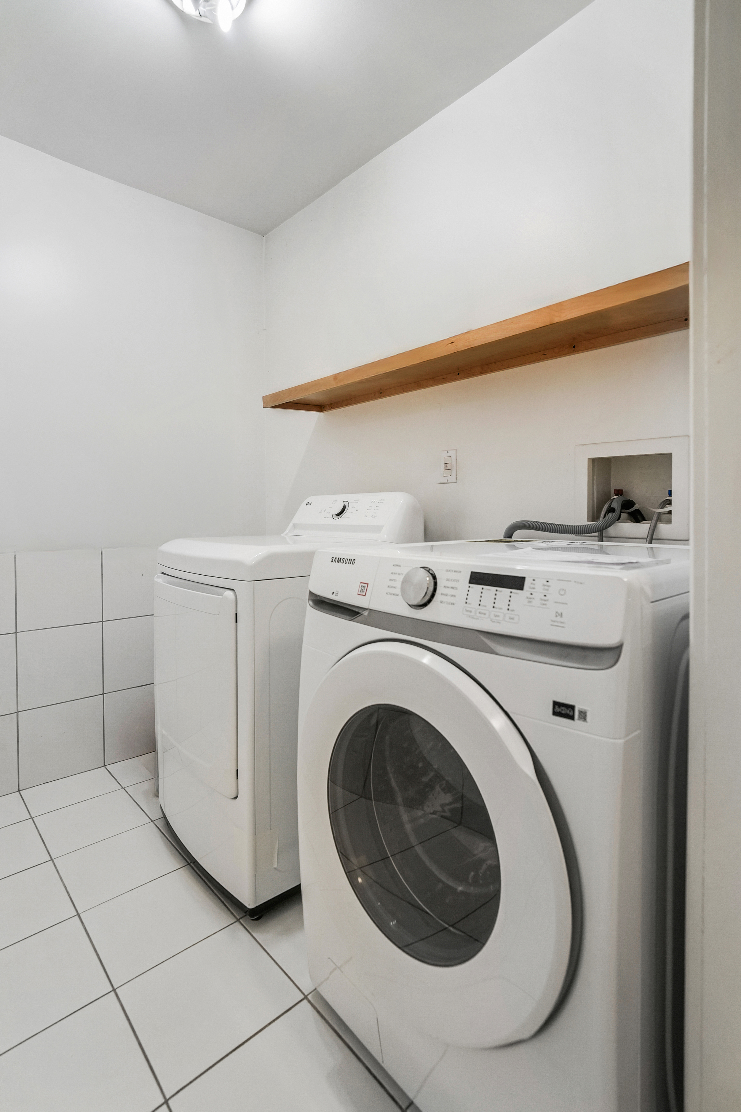 182 East 117th Street Manhattan, NY 10035 - Photo 11 of 13 a utility room with dryer and washer