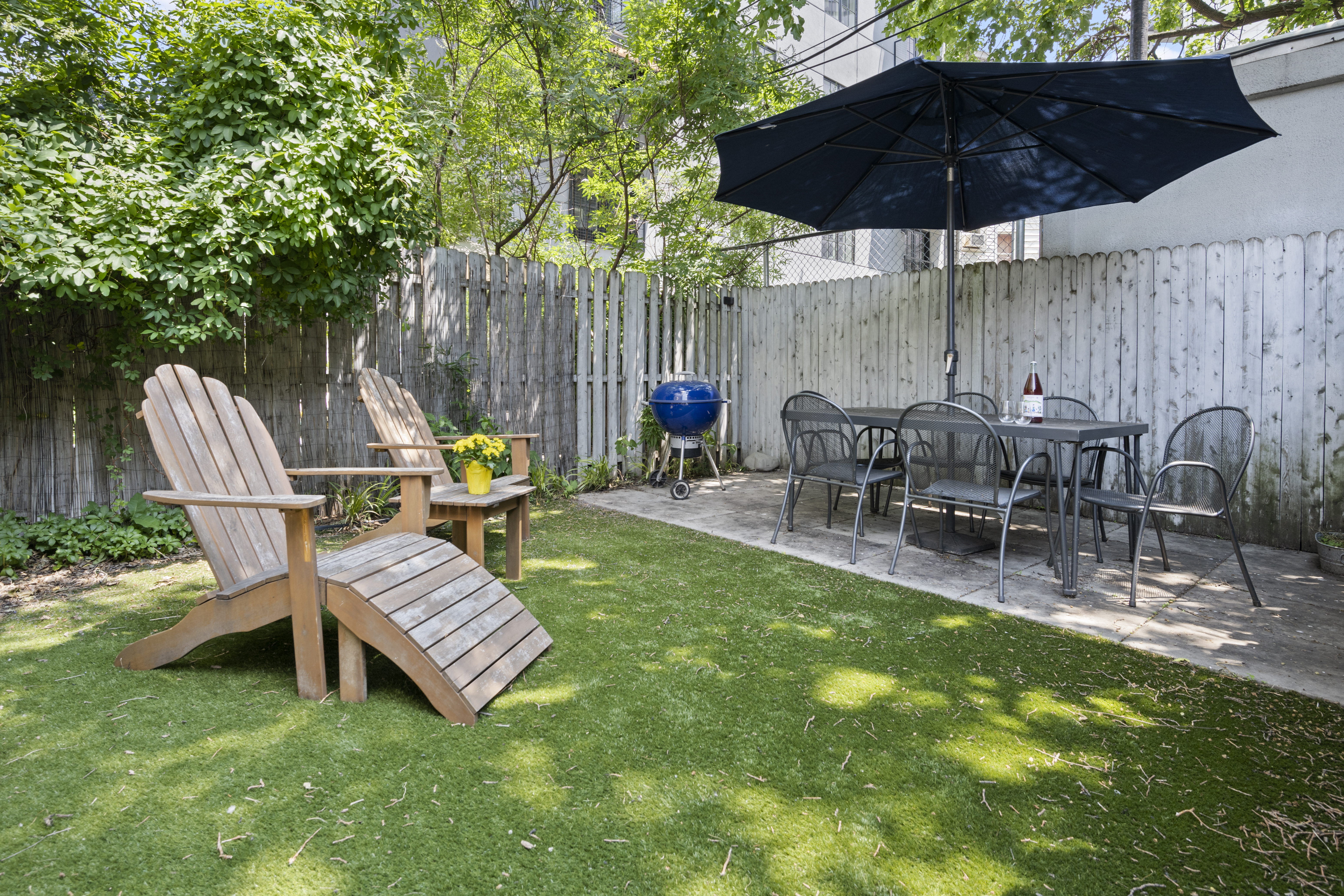 15 Roebling Street, Unit 2B Brooklyn, NY 11211 - Photo 7 of 9 a view of a chairs and table in backyard of the house