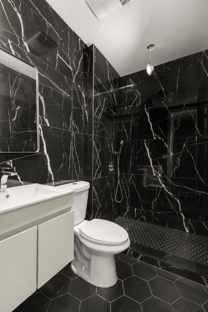 a bathroom with a toilet and shower