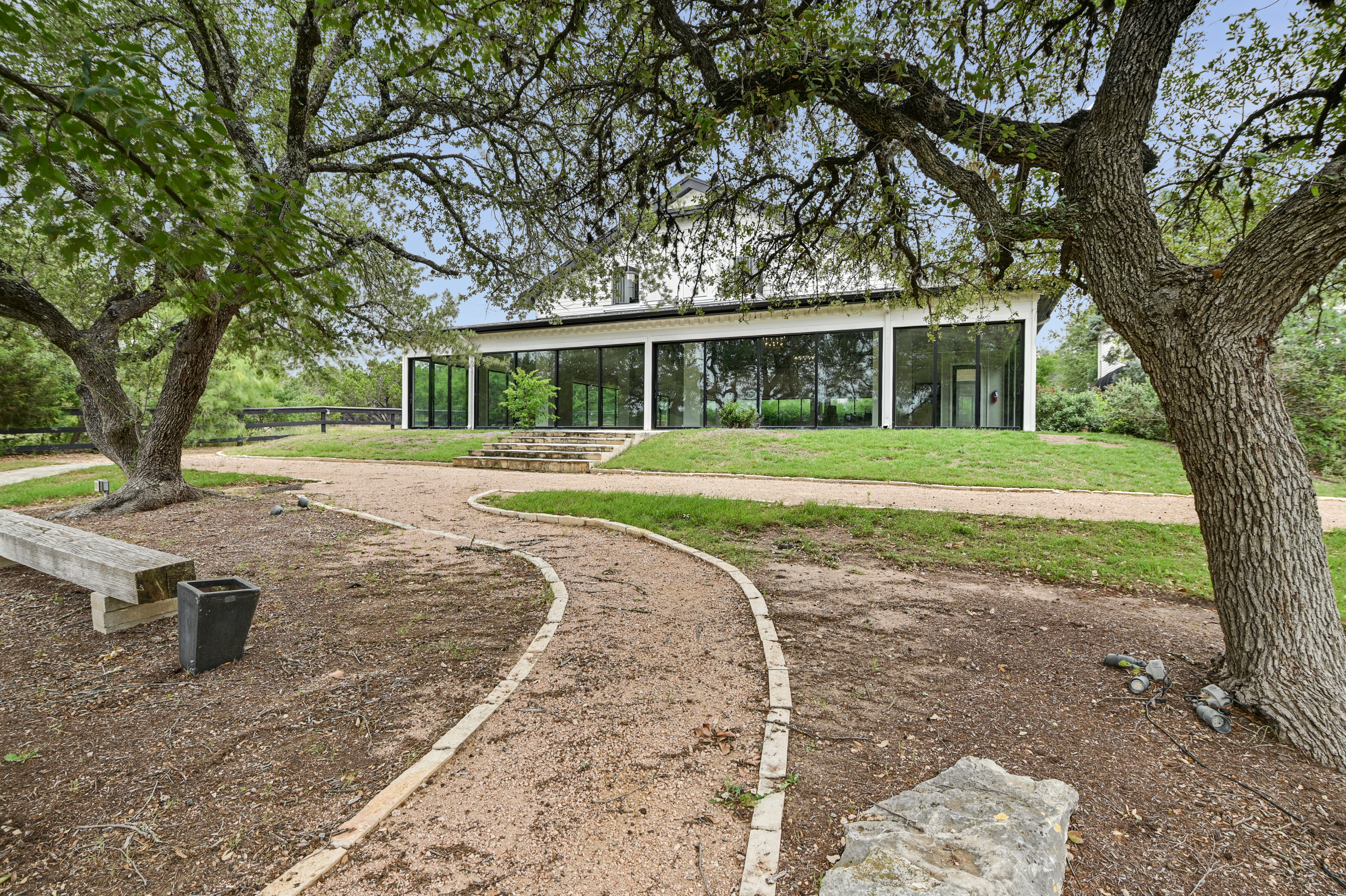 14913 Murfin Road Austin, TX 78734 - Photo 4 of 40 a front view of a house with a yard and trees