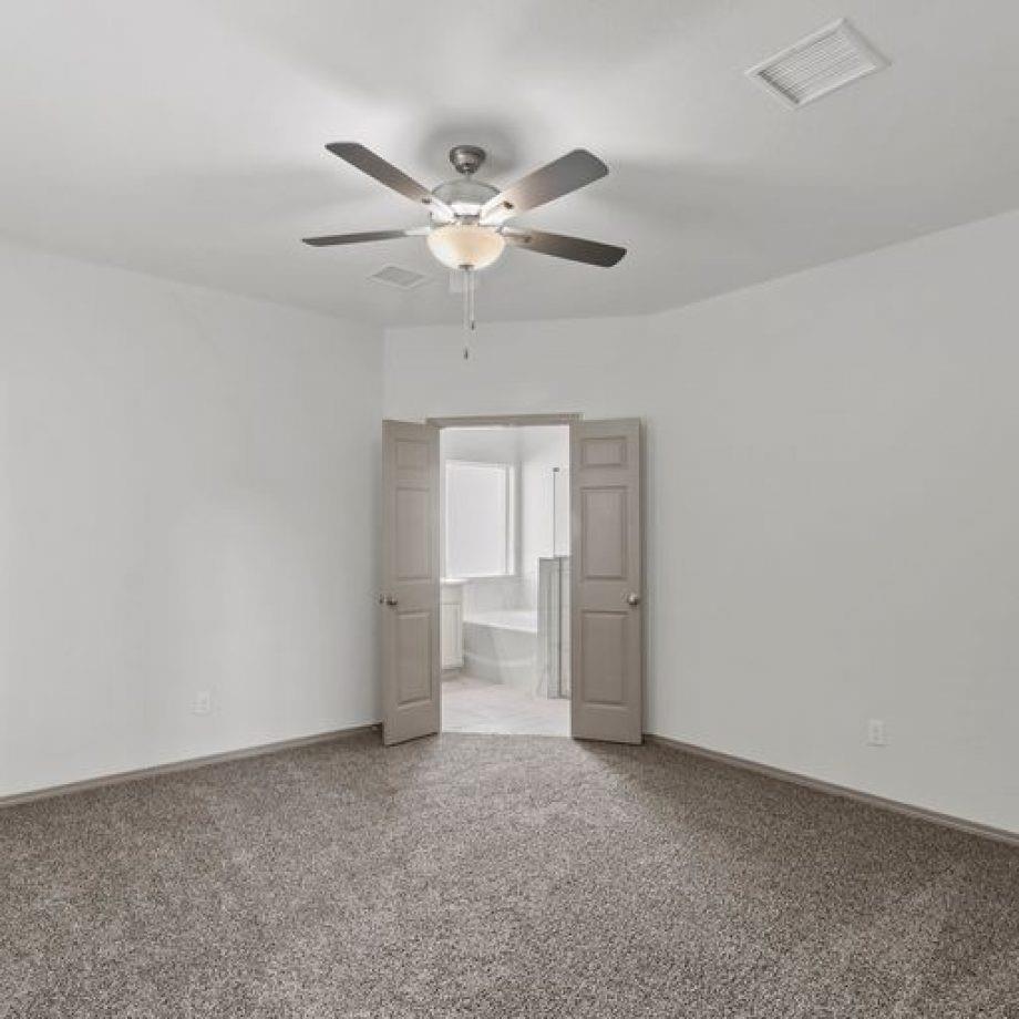 3506 Windmill Palm Manvel, TX 77578 - Photo 18 of 26 a view of empty room with a ceiling fan and window