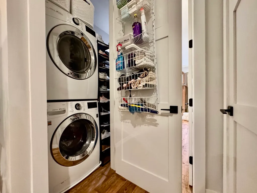 a view of a hallway with washer and dryer