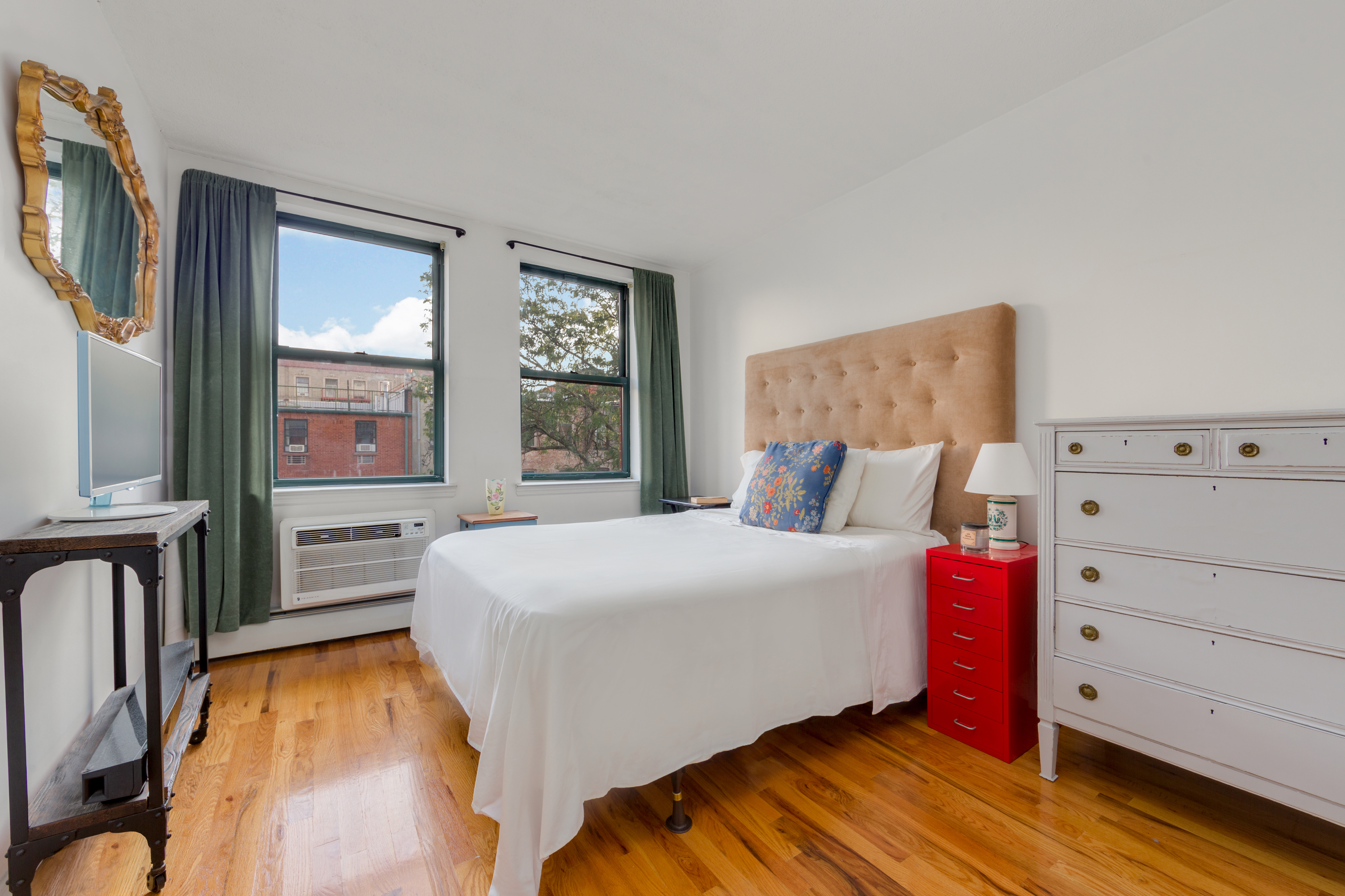 226 West 123rd Street, Unit 2 Manhattan, NY 10027 - Photo 4 of 9 a bedroom with a bed and a window