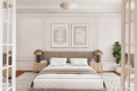 a bedroom with a bed and a potted plant