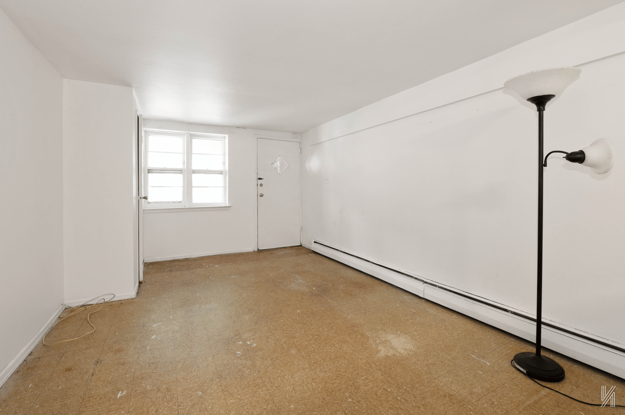 1148 East 73rd Street Brooklyn, NY 11234 - Photo 7 of 15 an empty room with windows