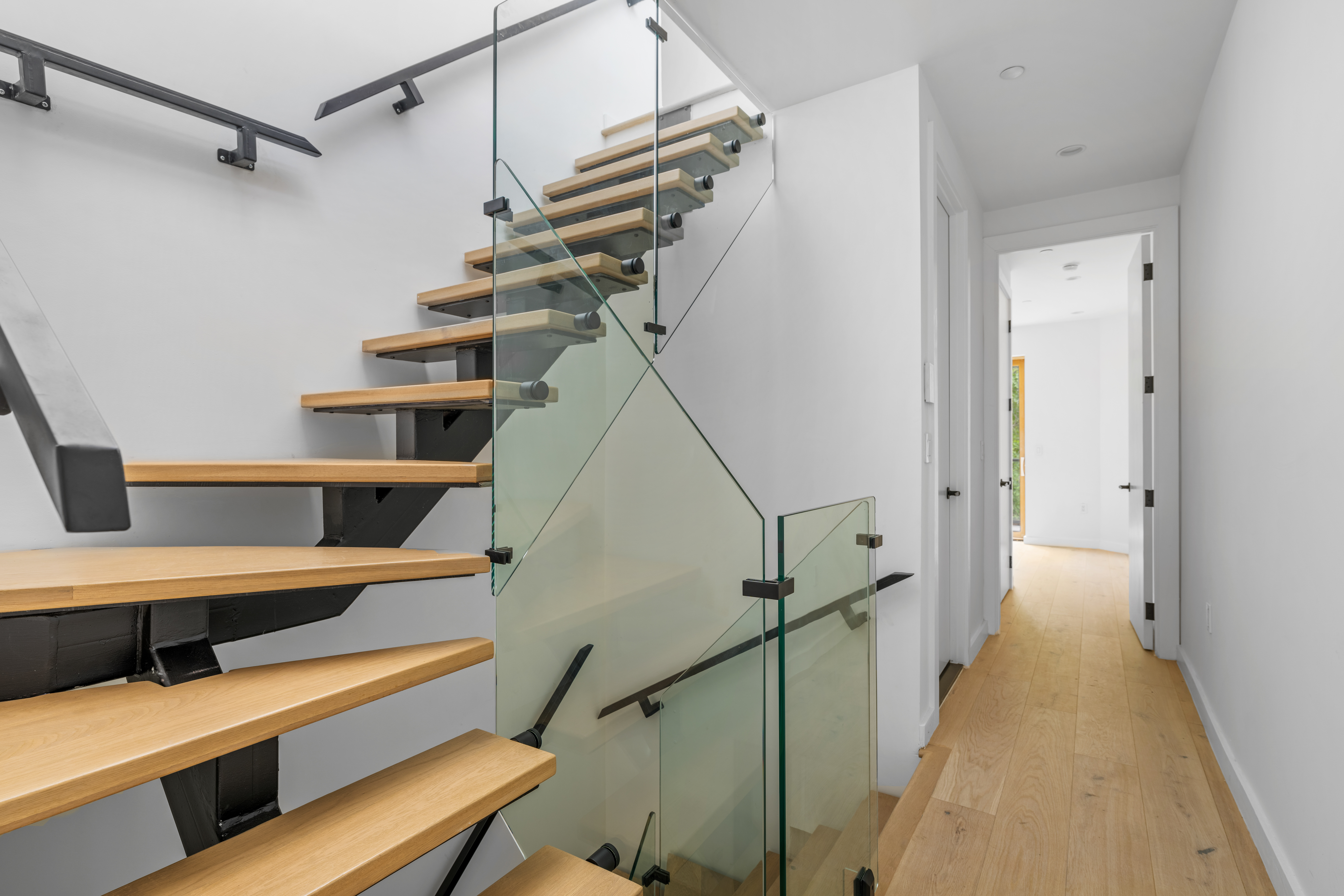 545 Lexington Avenue, Unit 2 Brooklyn, NY 11221 - Photo 7 of 23 a view of entryway and hall with wooden floor