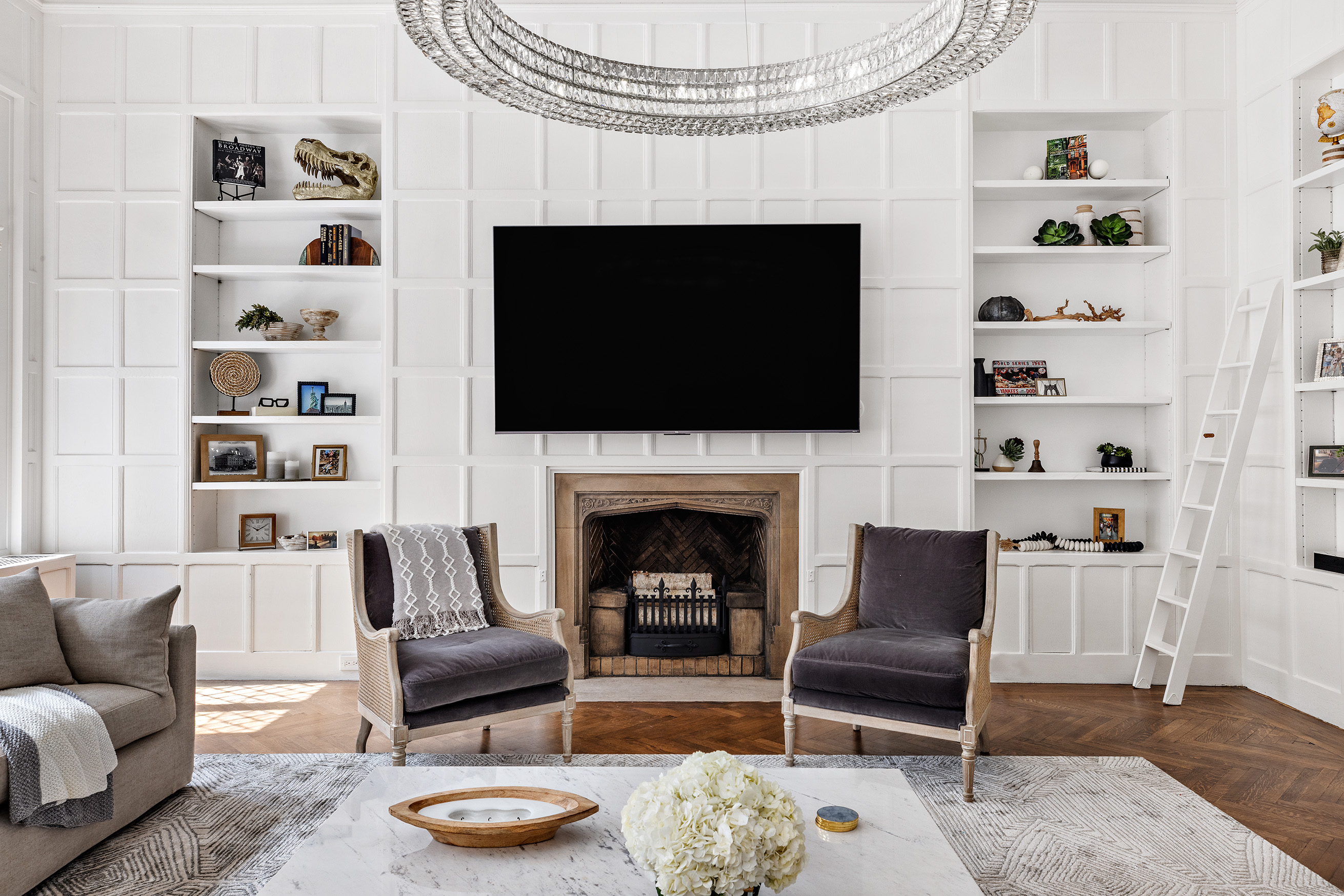 25 East 94th Street Manhattan, NY 10128 - Photo 26 of 33 a living room with furniture and a fireplace