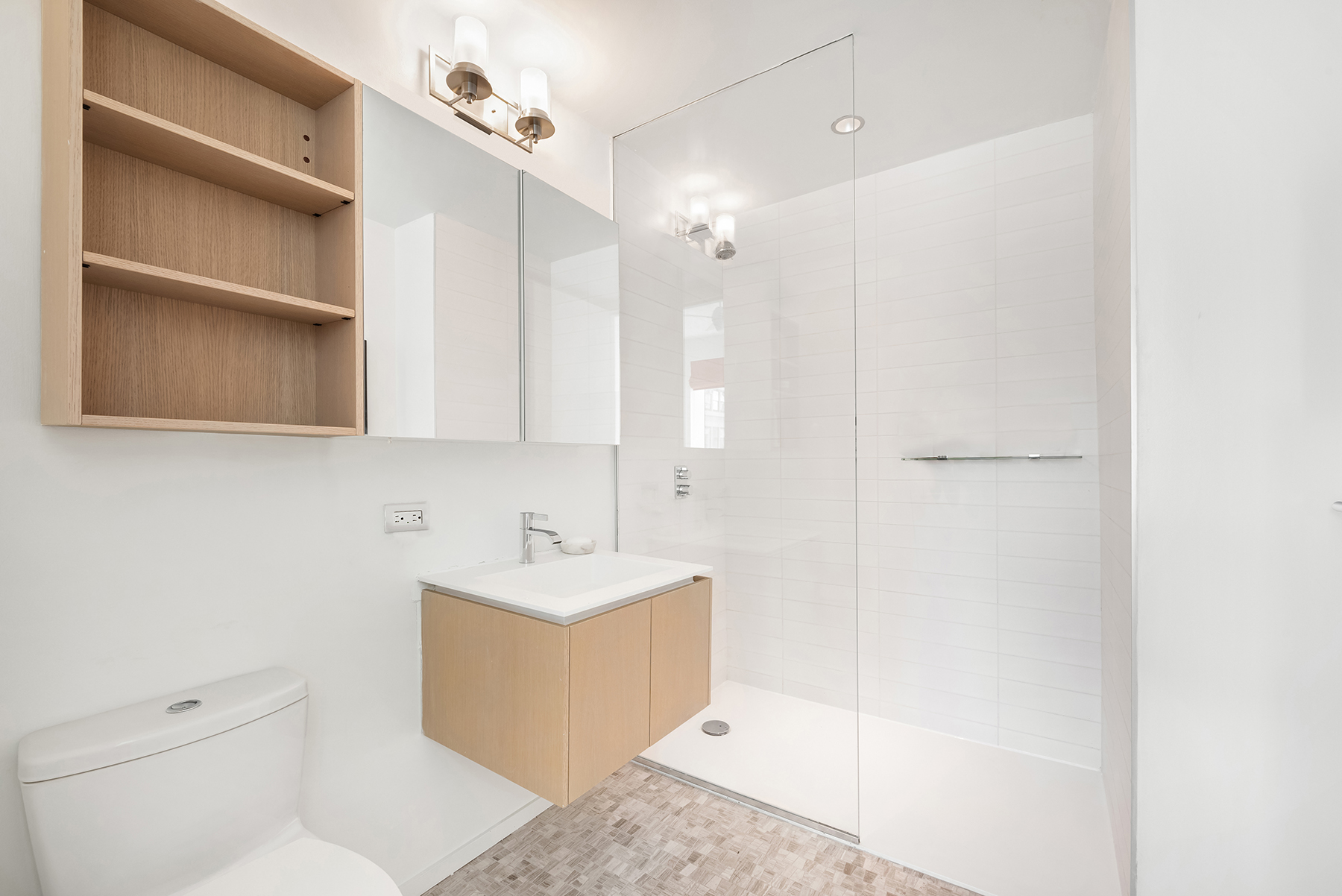 1 John Street, Unit 9D Brooklyn, NY 11201 - Photo 9 of 20 a bathroom with a sink a toilet and shower