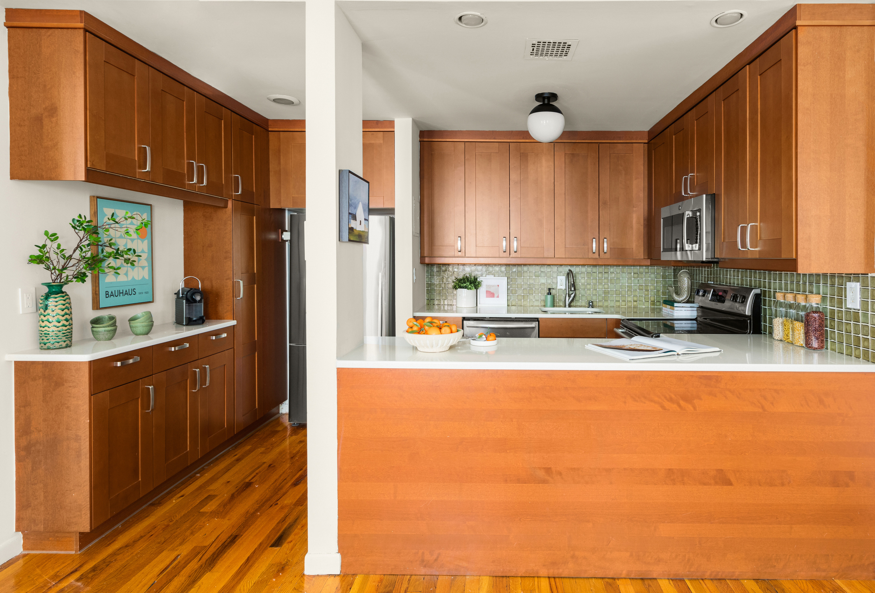 238 Clinton Street, Unit DE Brooklyn, NY 11201 - Photo 7 of 19 a kitchen with stainless steel appliances wooden cabinets a stove top oven a sink and dishwasher with wooden floor