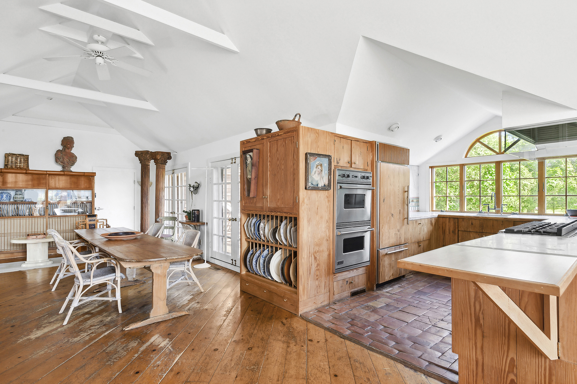 488 Ocean Road Bridgehampton, NY 11932 - Photo 11 of 21 a view of a dining room with furniture and a wooden floor