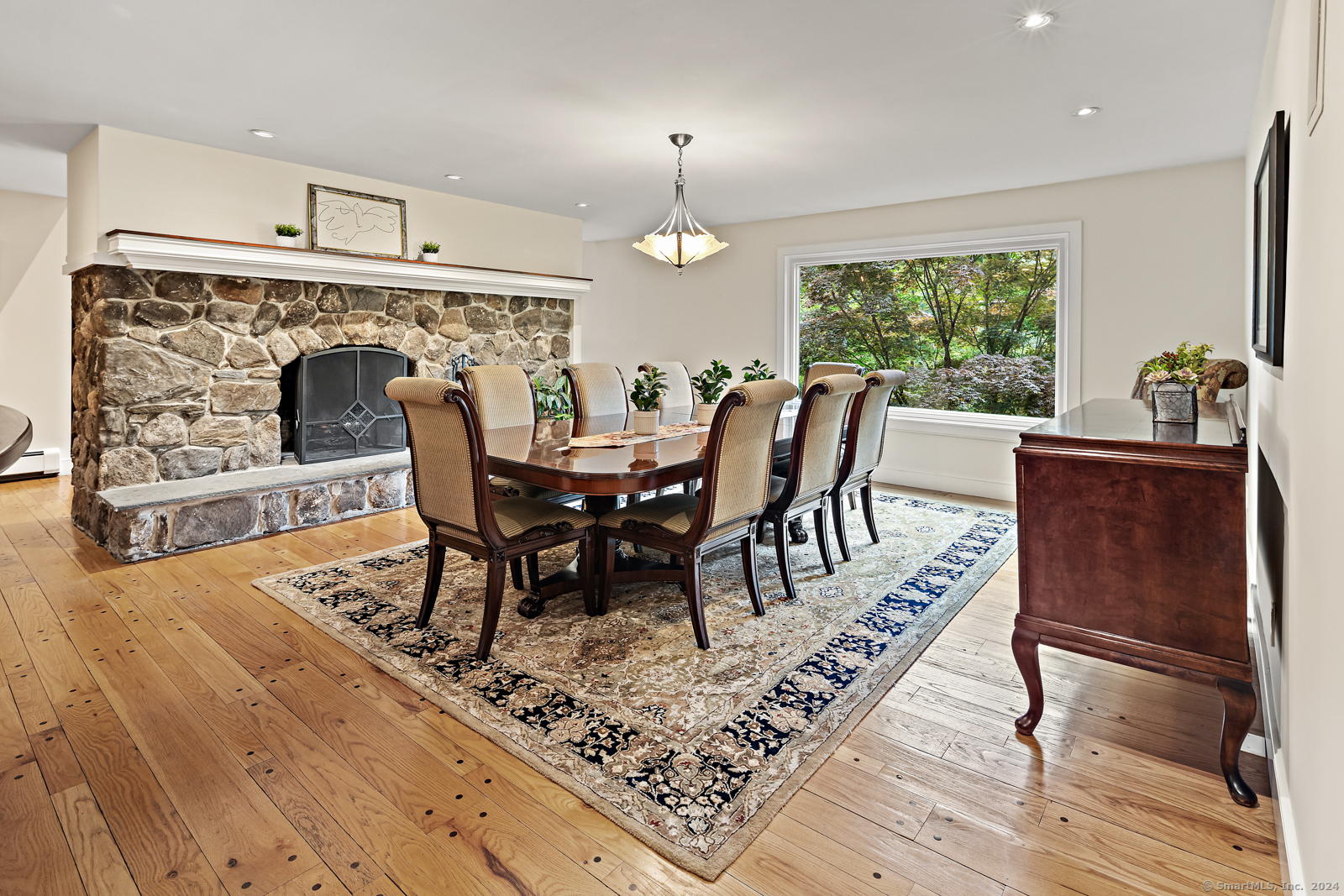 13 Bittersweet Road Weston, CT 06883 - Photo 8 of 35 a view of a dining room with furniture window and wooden floor