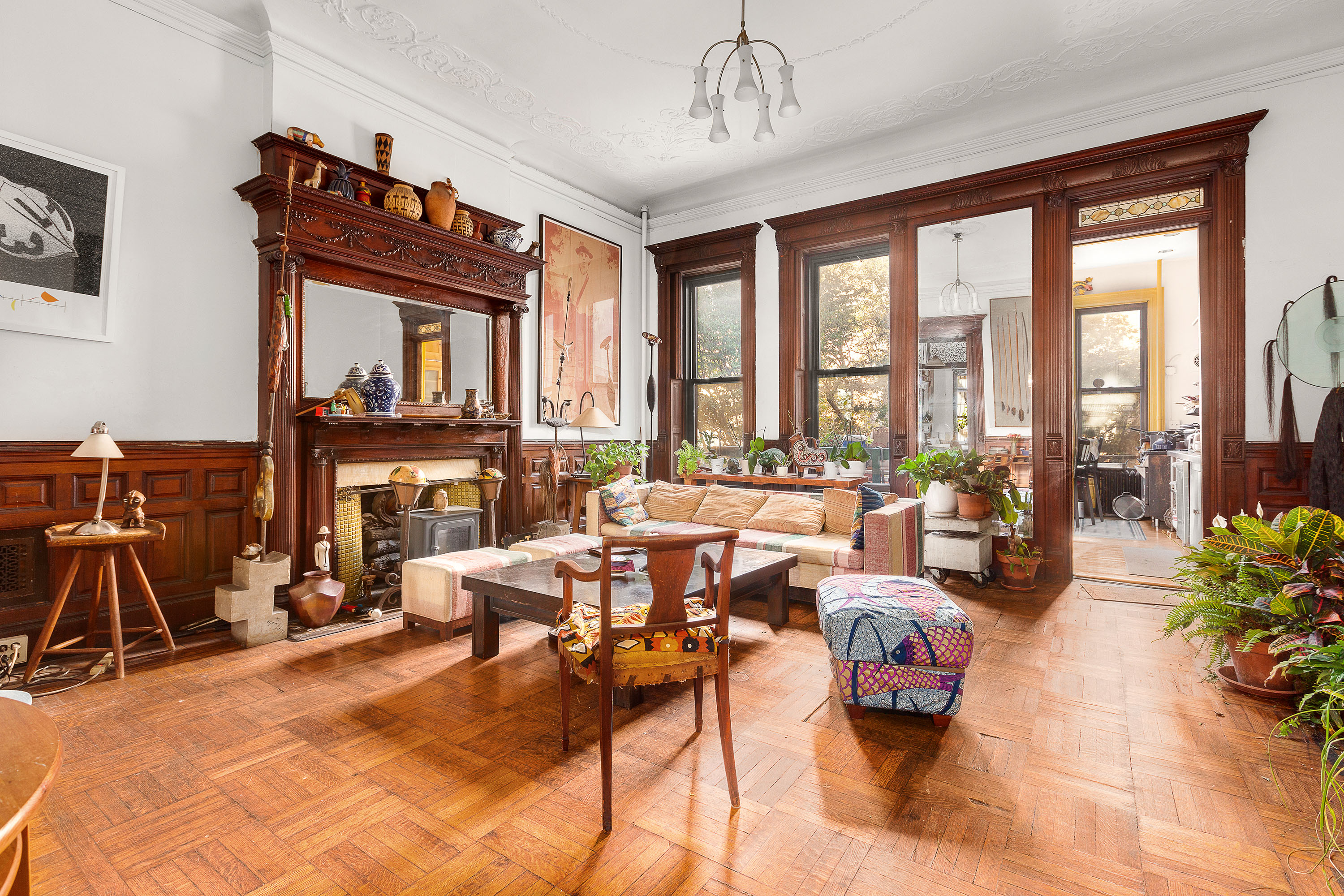 117 West 120th Street Manhattan, NY 10027 - Photo 11 of 31 a living room with fireplace furniture and a floor to ceiling window