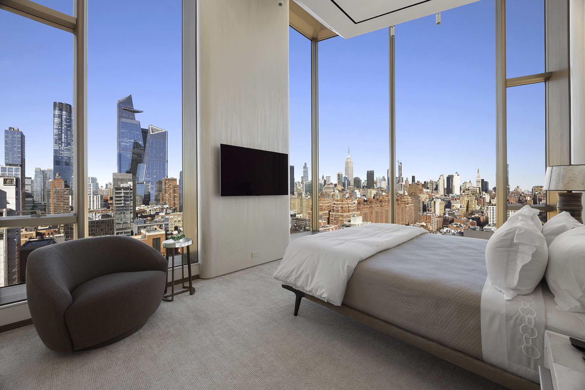 551 West 21st Street, Unit PH Manhattan, NY 10011 - Photo 40 of 51 a bedroom with a bed couch and a flat screen tv