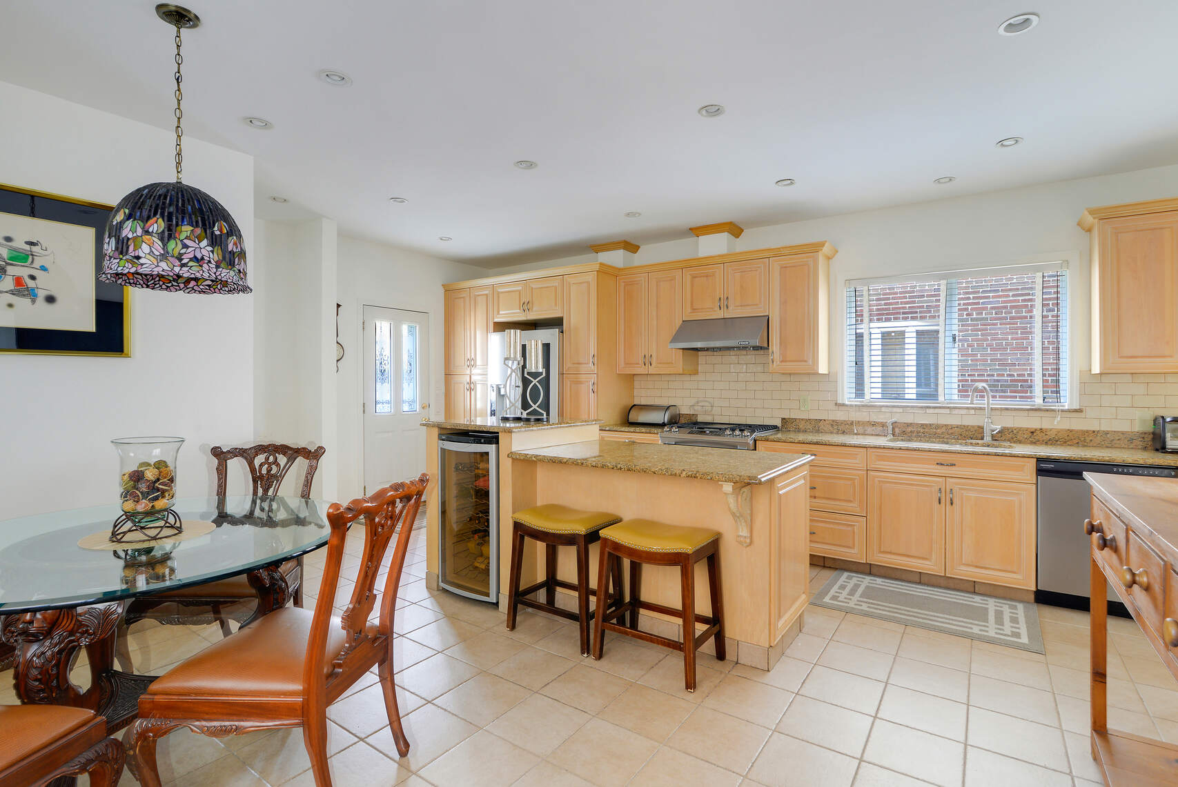 139 82nd Street Brooklyn, NY 11209 - Photo 10 of 23 a dining room with a granite top table and chairs