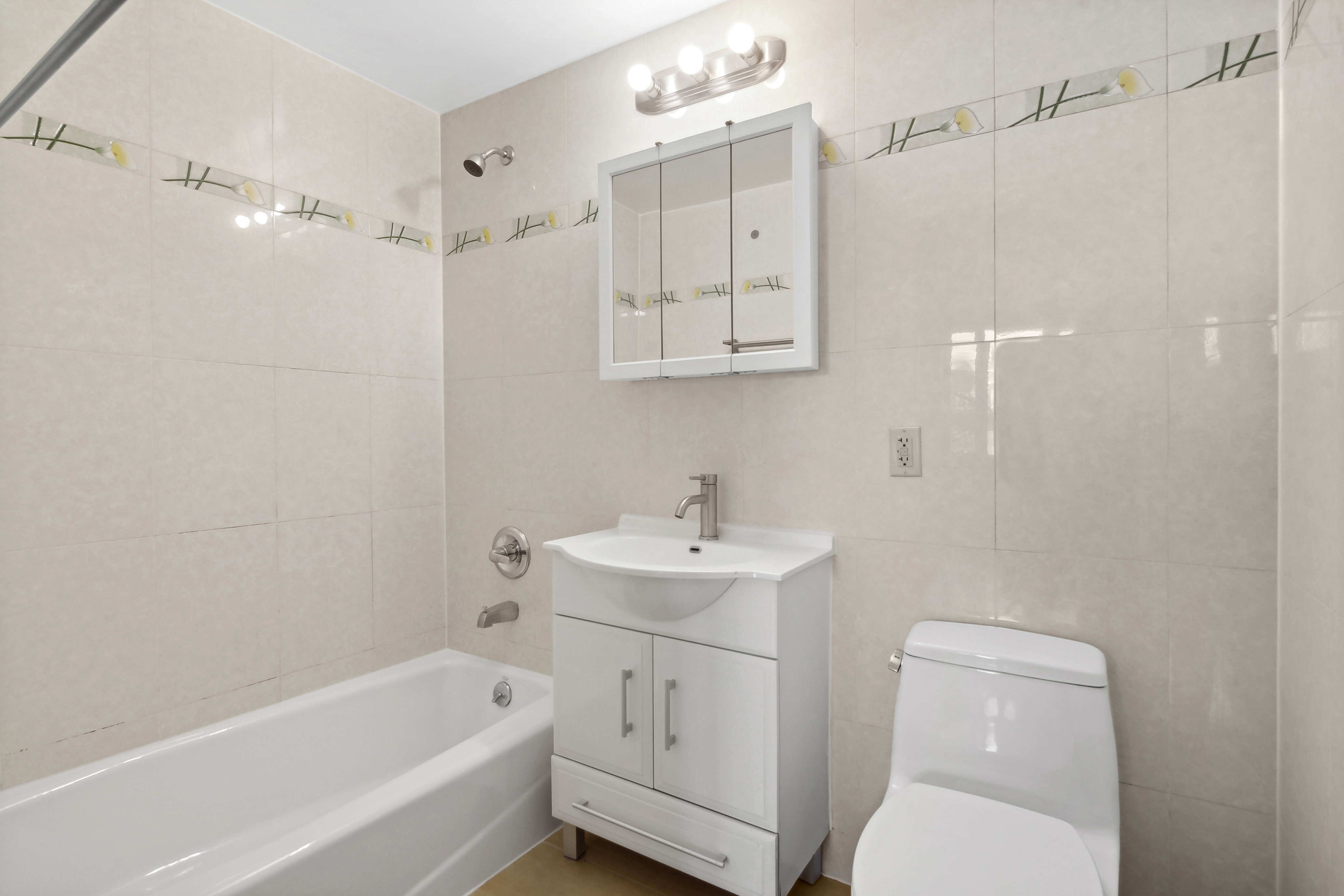 63-14 Queens Boulevard, Unit 7P Queens, NY 11377 - Photo 9 of 10 a bathroom with a sink a toilet and shower