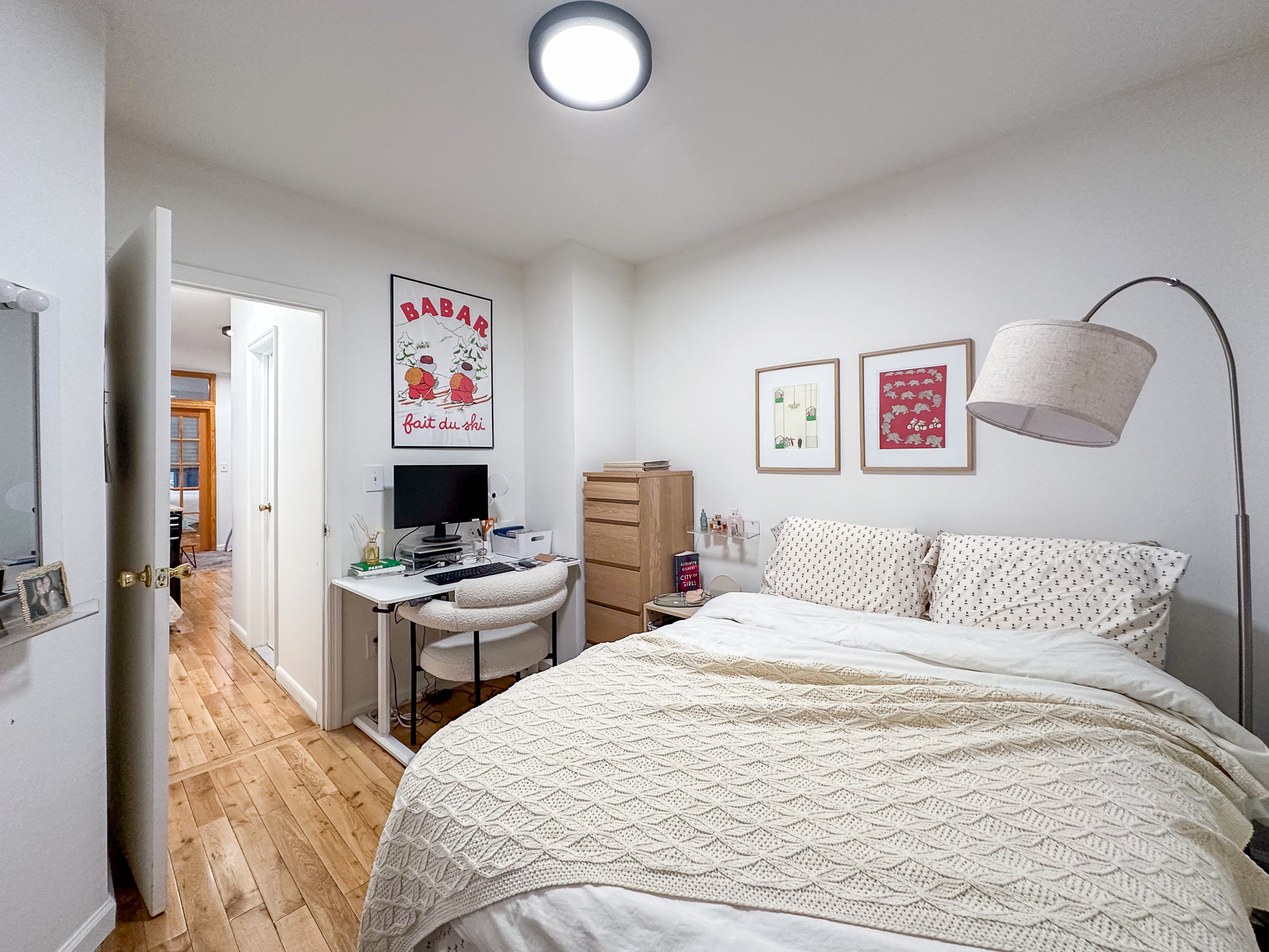 321 East 25th Street, Unit 3A Manhattan, NY 10010 - Photo 7 of 15 a bedroom with a bed and a flat screen tv