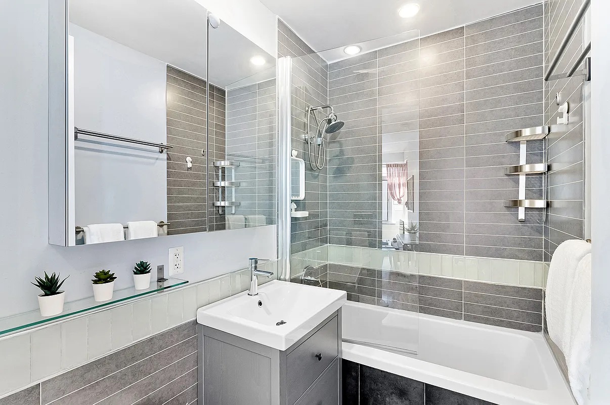 12 Monitor Street, Unit 3B Brooklyn, NY 11222 - Photo 8 of 11 a bathroom with a sink and a bathtub