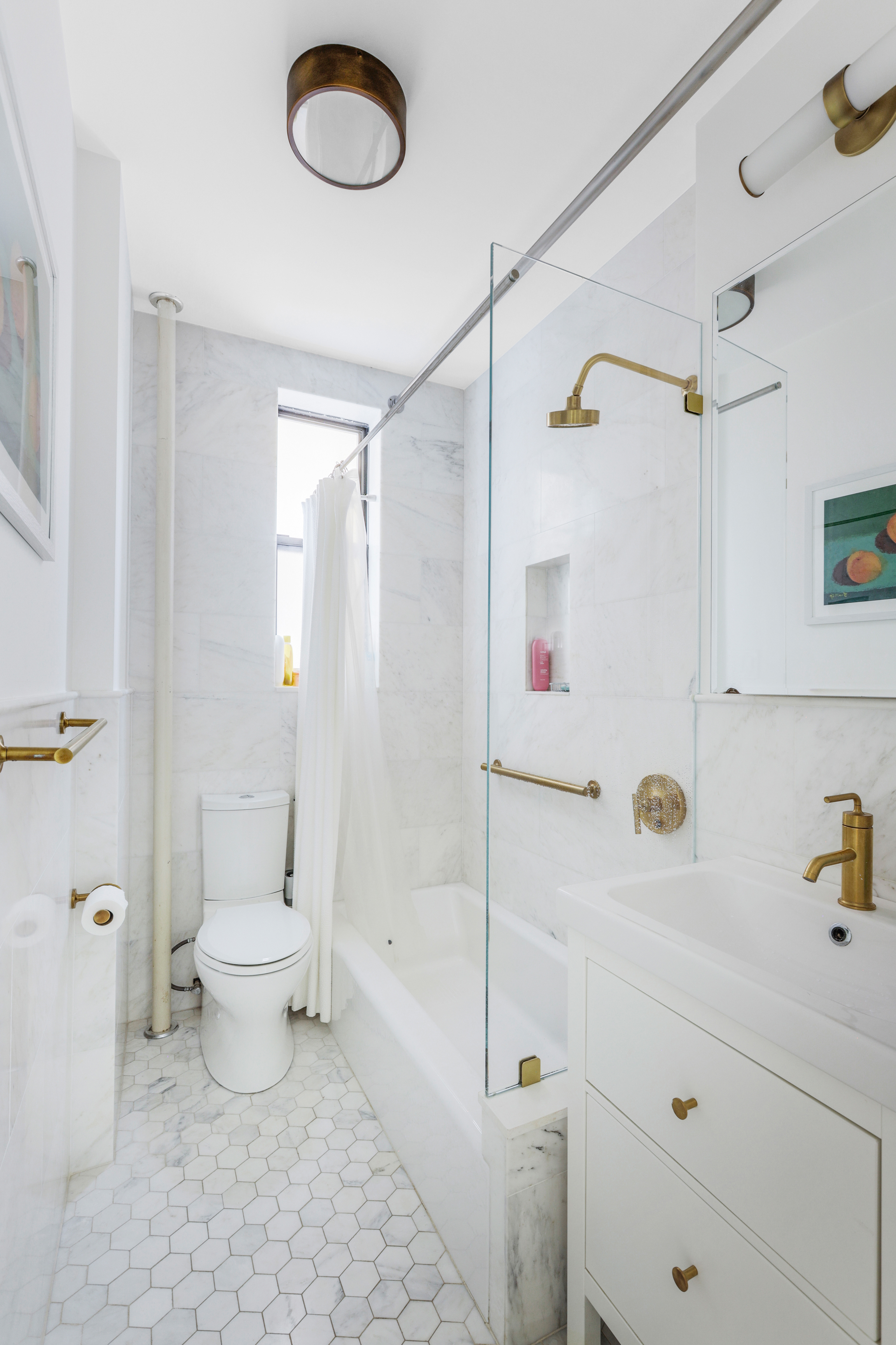 2 Grace Court, Unit 2C Brooklyn, NY 11201 - Photo 6 of 15 a bathroom with a sink a toilet and shower