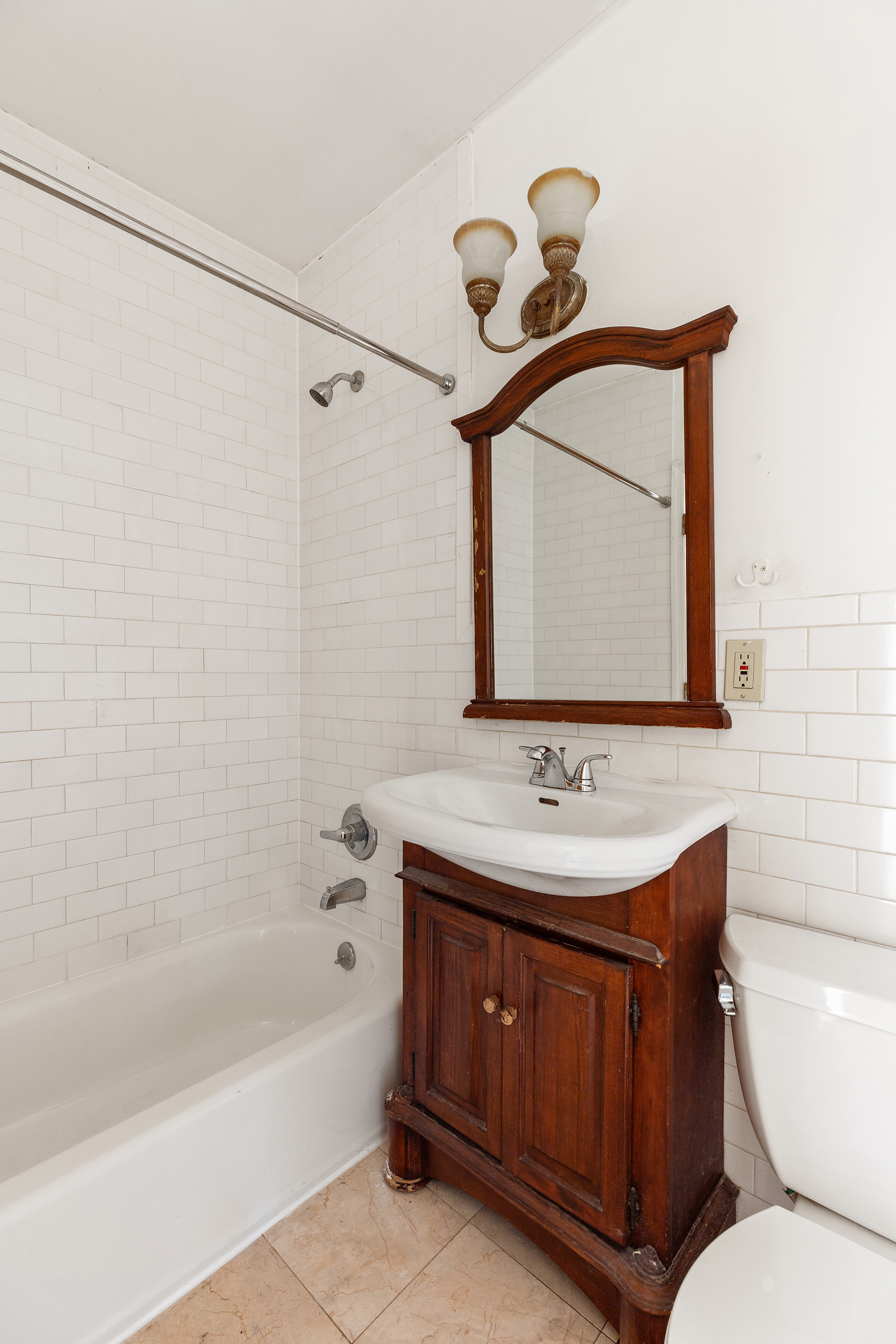 37 Quincy Street Brooklyn, NY 11238 - Photo 20 of 24 a bathroom with a toilet sink and mirror