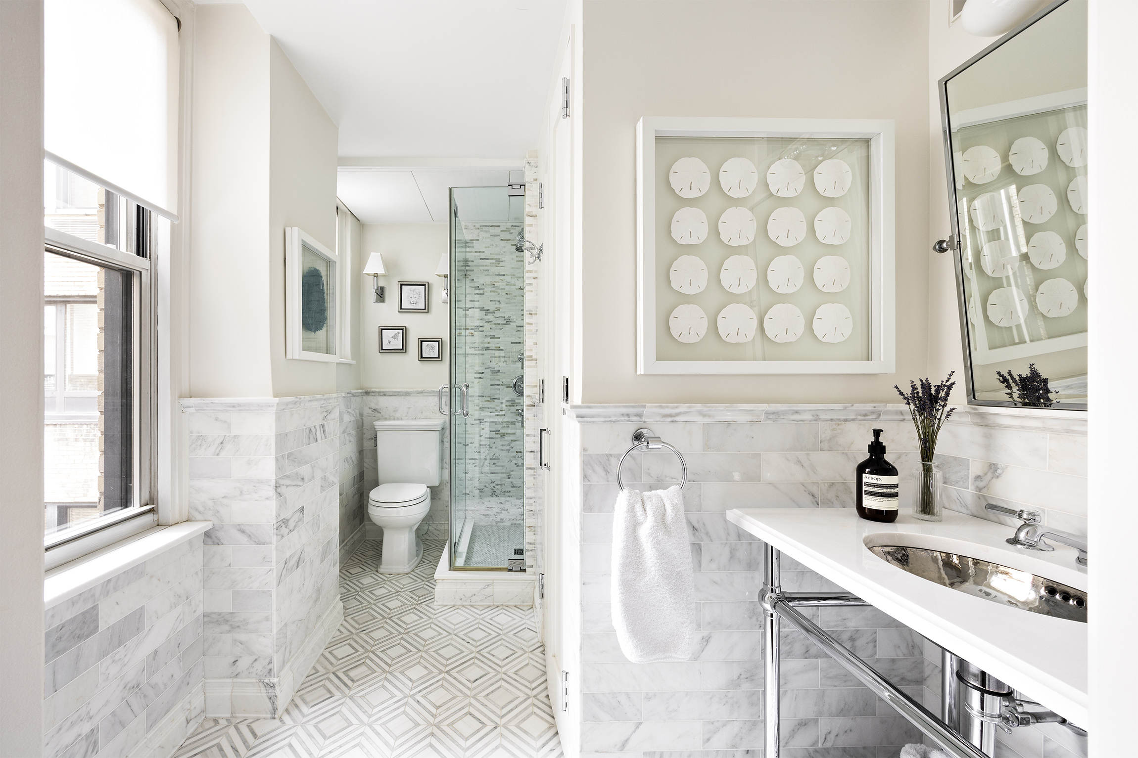 21 East 87th Street, Unit 10D Manhattan, NY 10128 - Photo 9 of 11 a bathroom with a sink toilet and shower