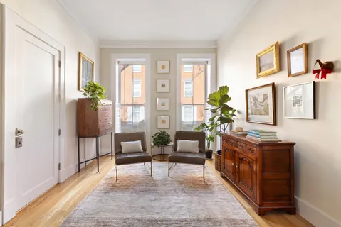 a living room with furniture and a table