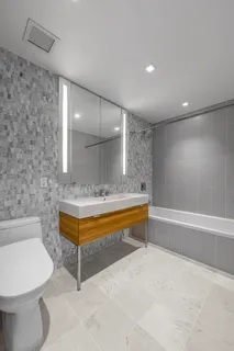 a bathroom with a bathtub and a sink