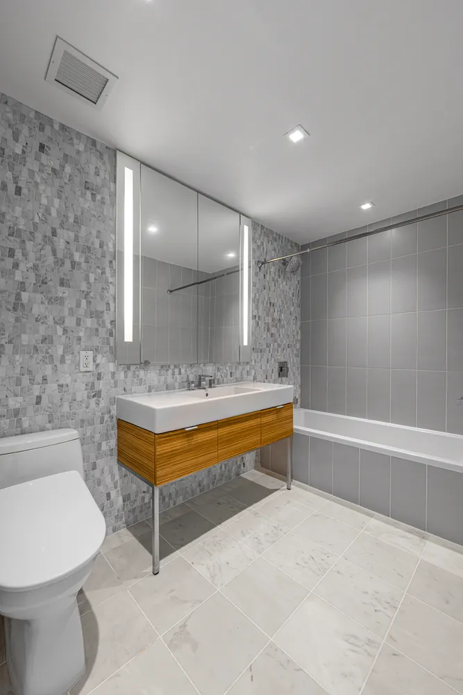 a bathroom with a bathtub and a sink