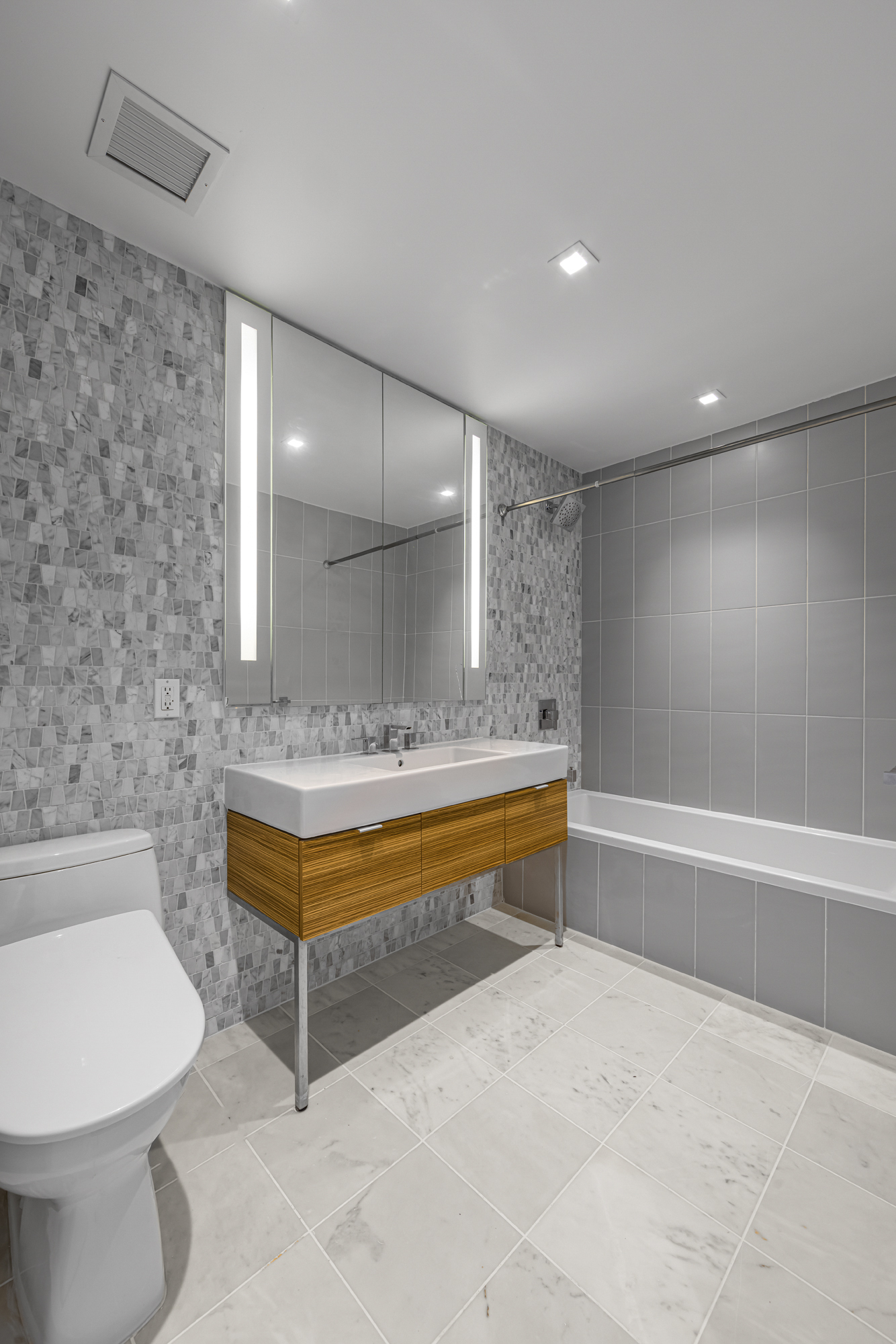 202 8th Street, Unit 4E Brooklyn, NY 11215 - Photo 12 of 19 a bathroom with a bathtub and a sink