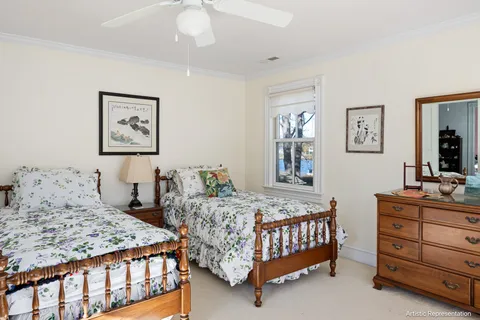a bedroom with a bed and a dresser