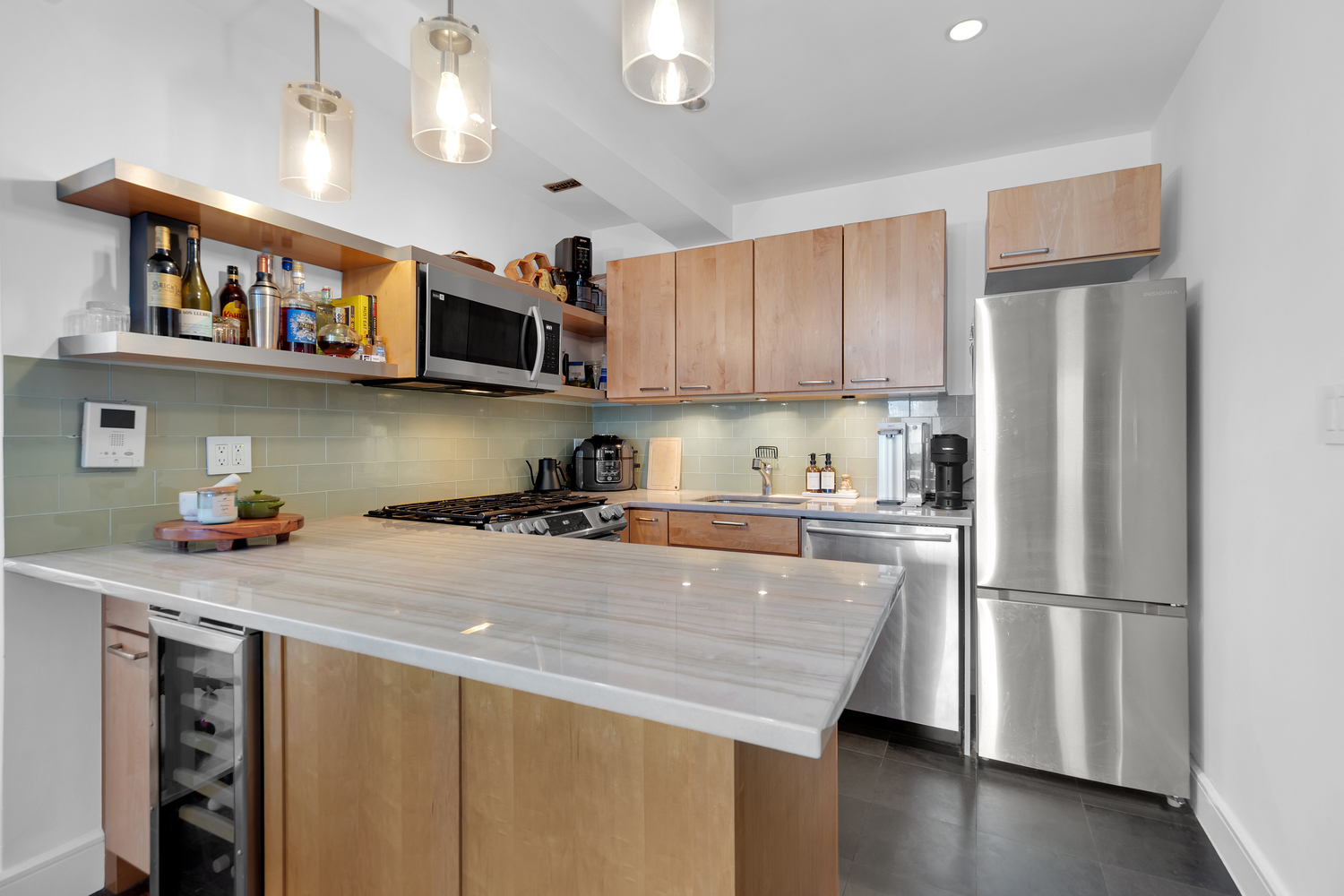 175 East 2nd Street, Unit 4D Manhattan, NY 10009 - Photo 3 of 8 a kitchen with stainless steel appliances granite countertop a refrigerator a stove a sink dishwasher and a refrigerator with wooden floor