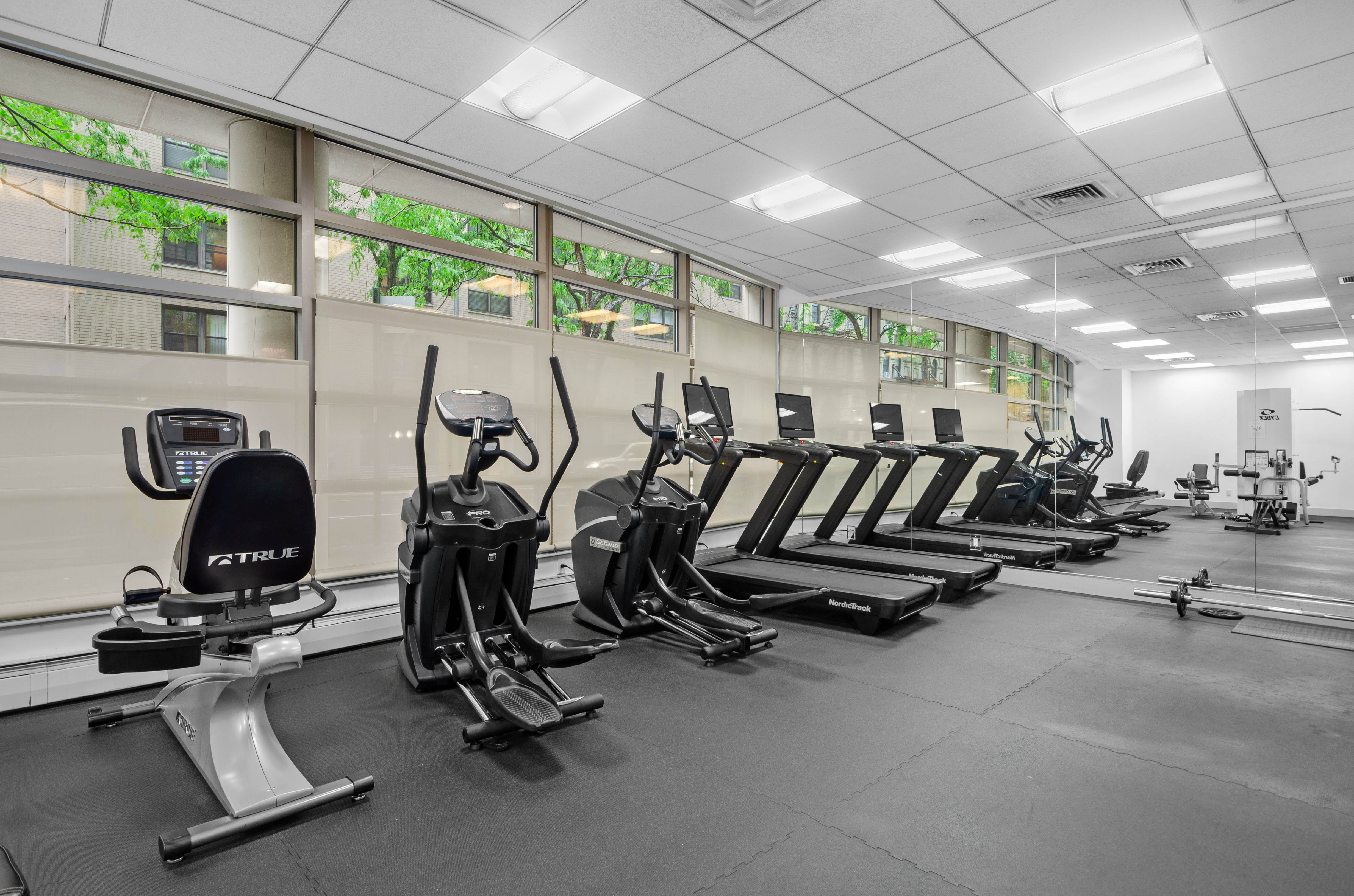 242 East 25th Street, Unit 5B Manhattan, NY 10010 - Photo 10 of 12 a view of a room with gym equipment
