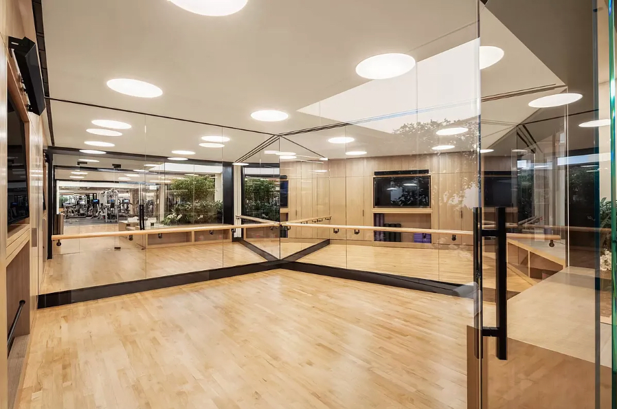 111 Murray Street, Unit 11C Manhattan, NY 10007 - Photo 13 of 14 a view of a living room with kitchen area and a flat screen tv