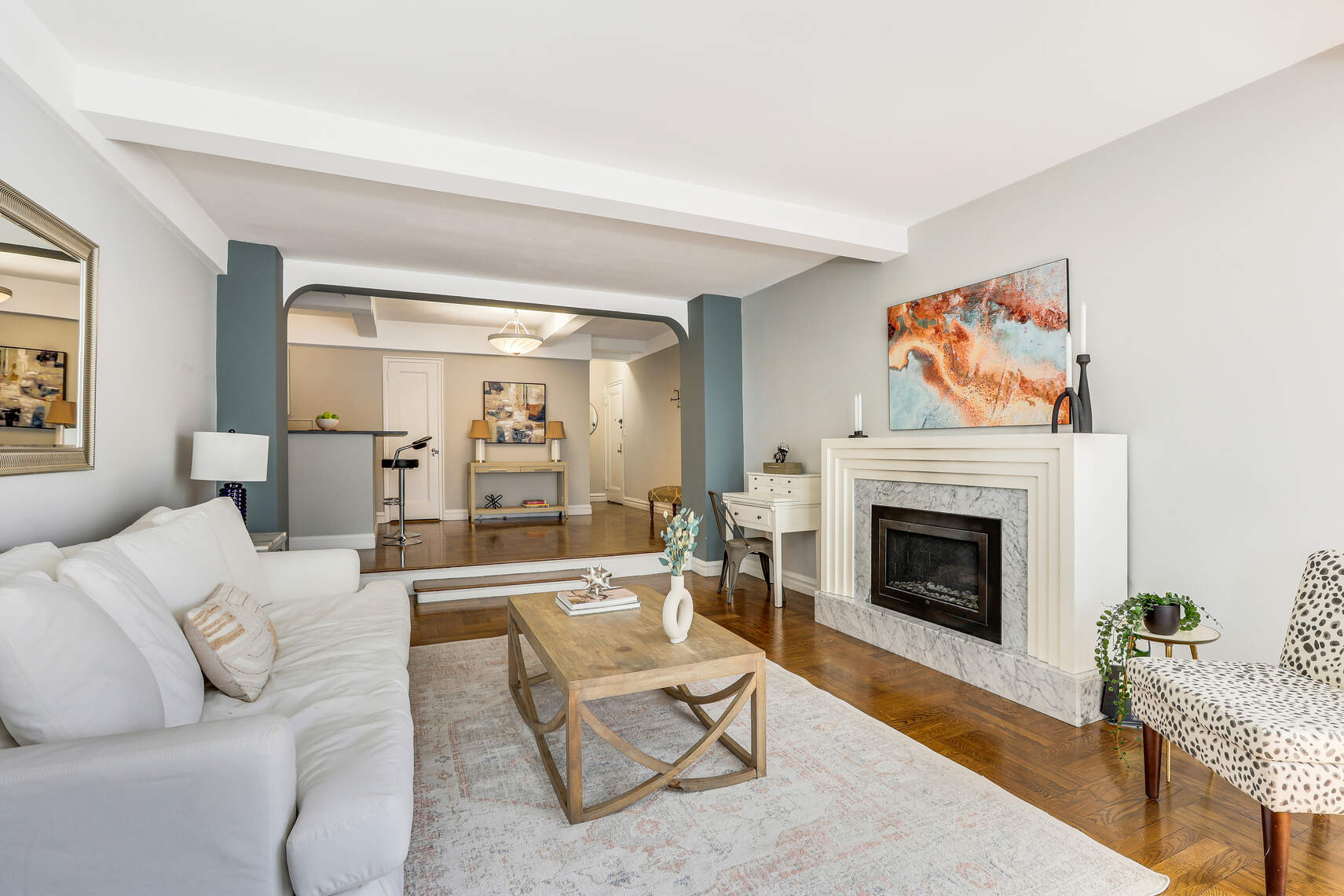 565 West End Avenue, Unit 3C Manhattan, NY 10024 - Photo 5 of 15 a living room with furniture and a fireplace