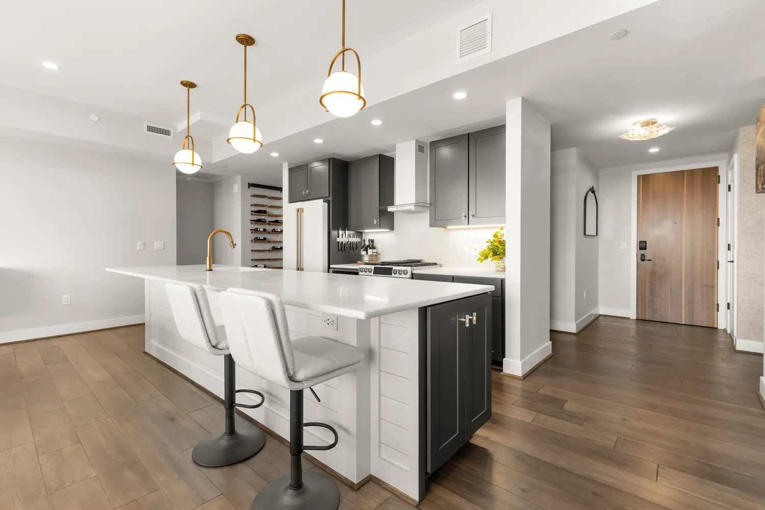 a kitchen with center island and stainless steel appliances