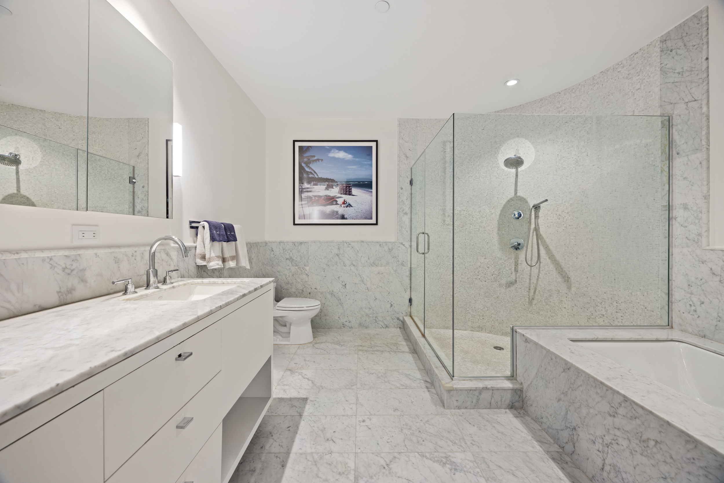 415 Greenwich Street, Unit 5D Manhattan, NY 10013 - Photo 7 of 16 a bathroom with a double vanity sink toilet and shower