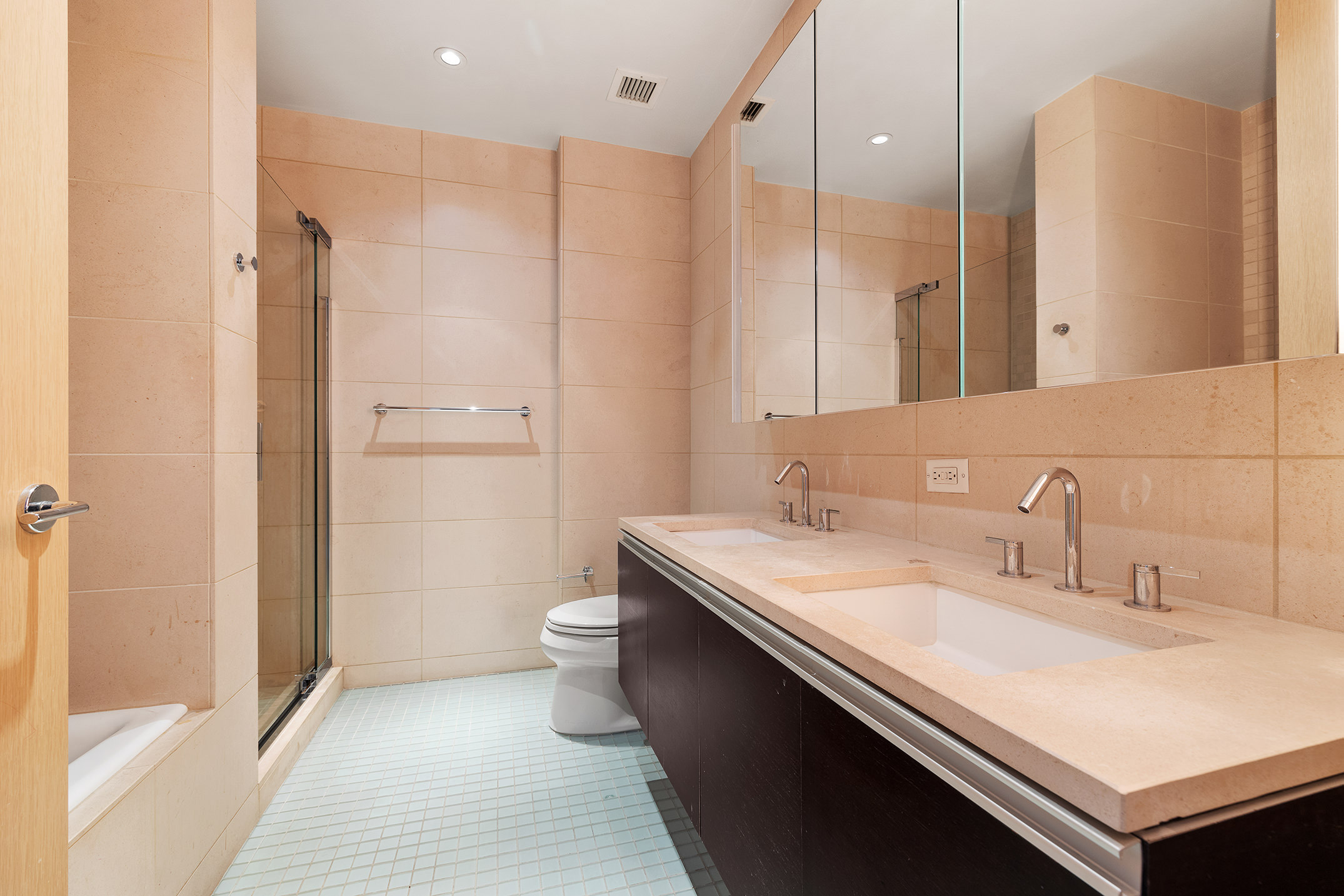 110 3rd Avenue, Unit 4C Manhattan, NY 10003 - Photo 7 of 17 a bathroom with a sink a toilet and shower