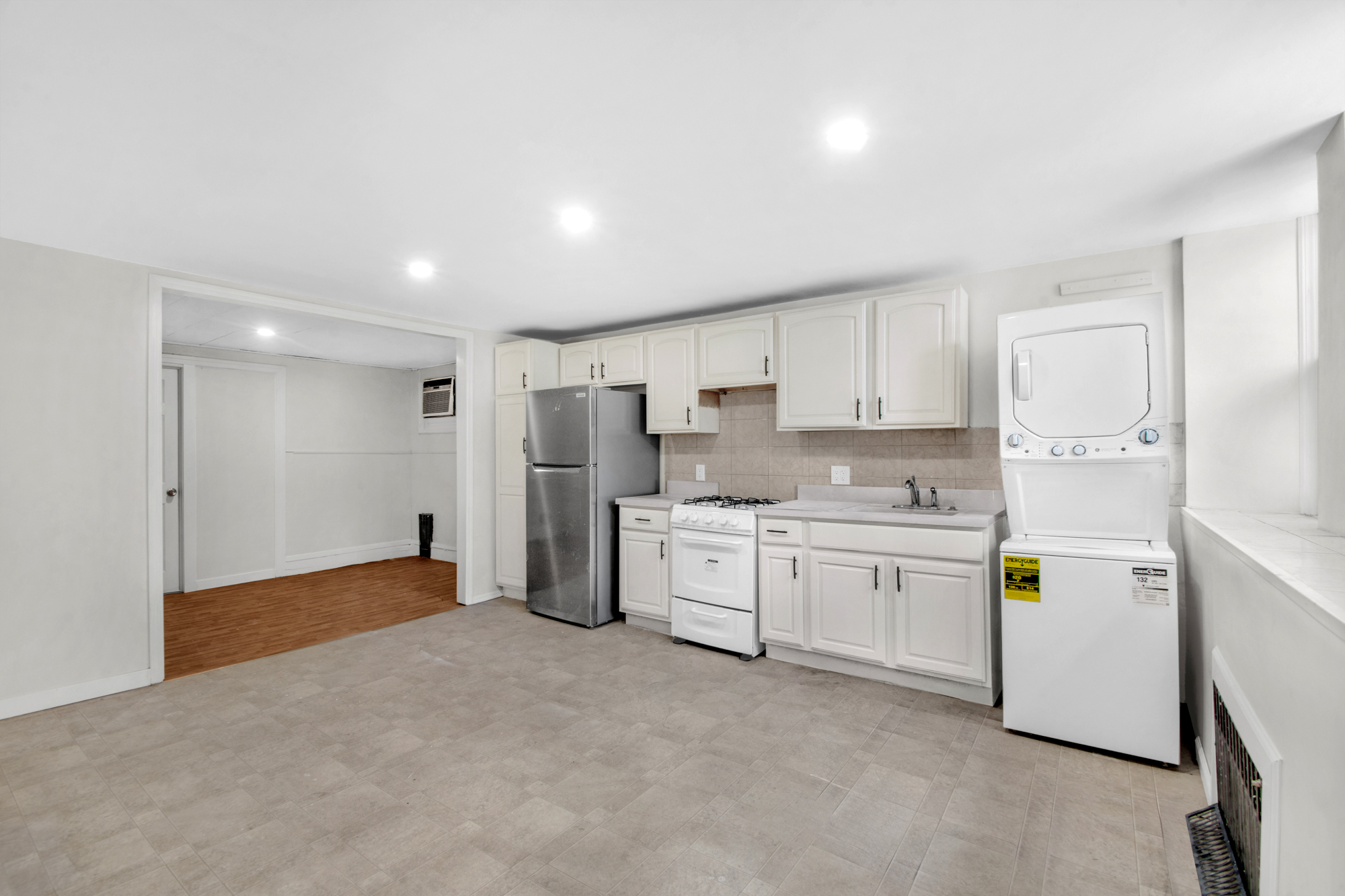 178 30th Street, Unit 1 Brooklyn, NY 11232 - Photo 6 of 6 a kitchen with refrigerator and cabinets