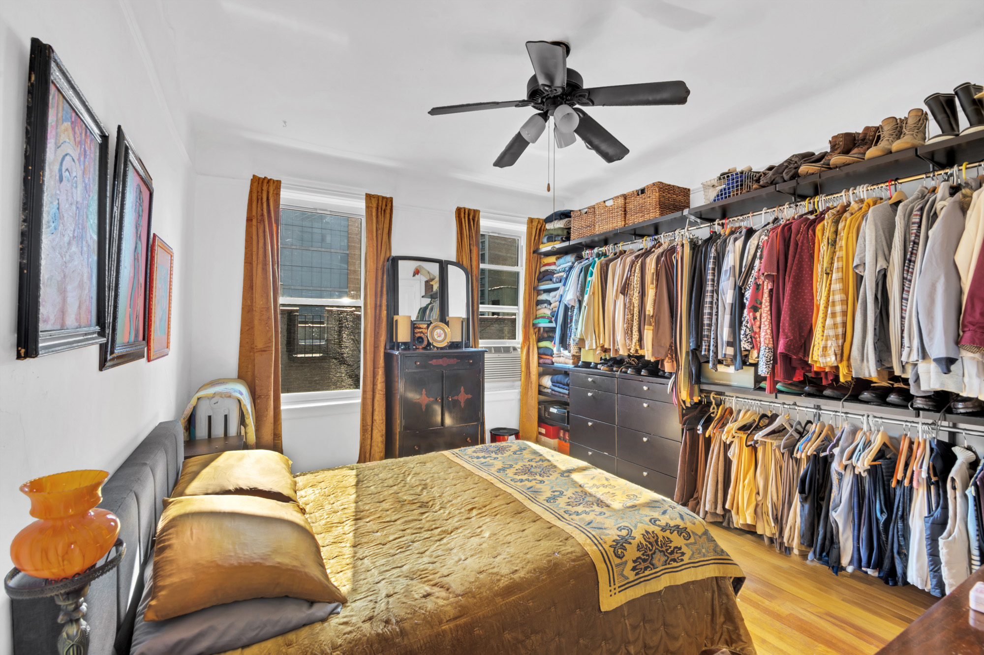 720 West 173rd Street, Unit 59 Manhattan, NY 10032 - Photo 6 of 11 a bedroom with a bed and a walk in closet