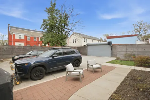 a view of a car parked in front of a house