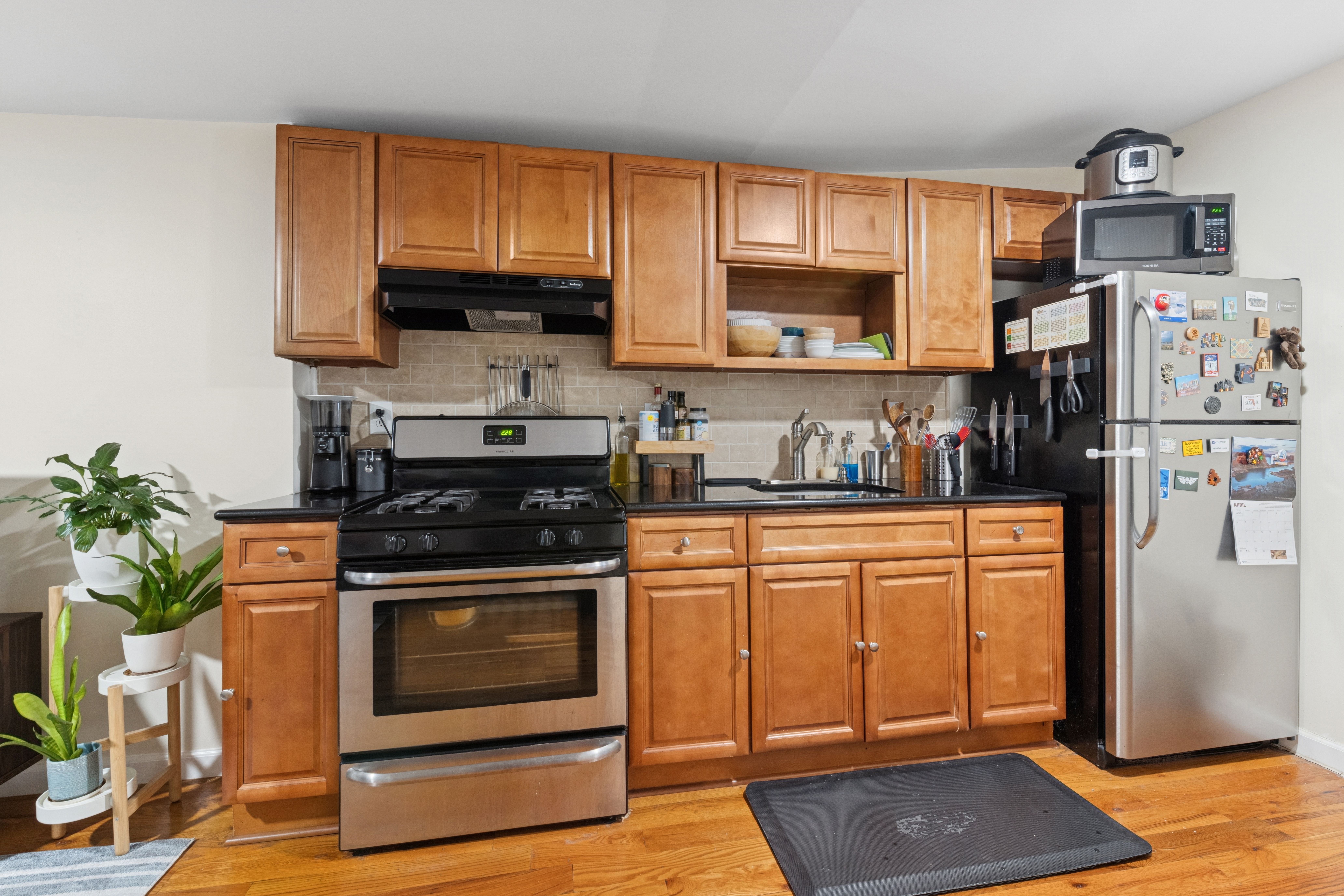 514 Classon Avenue, Unit 3 Brooklyn, NY 11238 - Photo 2 of 7 a kitchen with stainless steel appliances granite countertop a stove a refrigerator and a cabinets